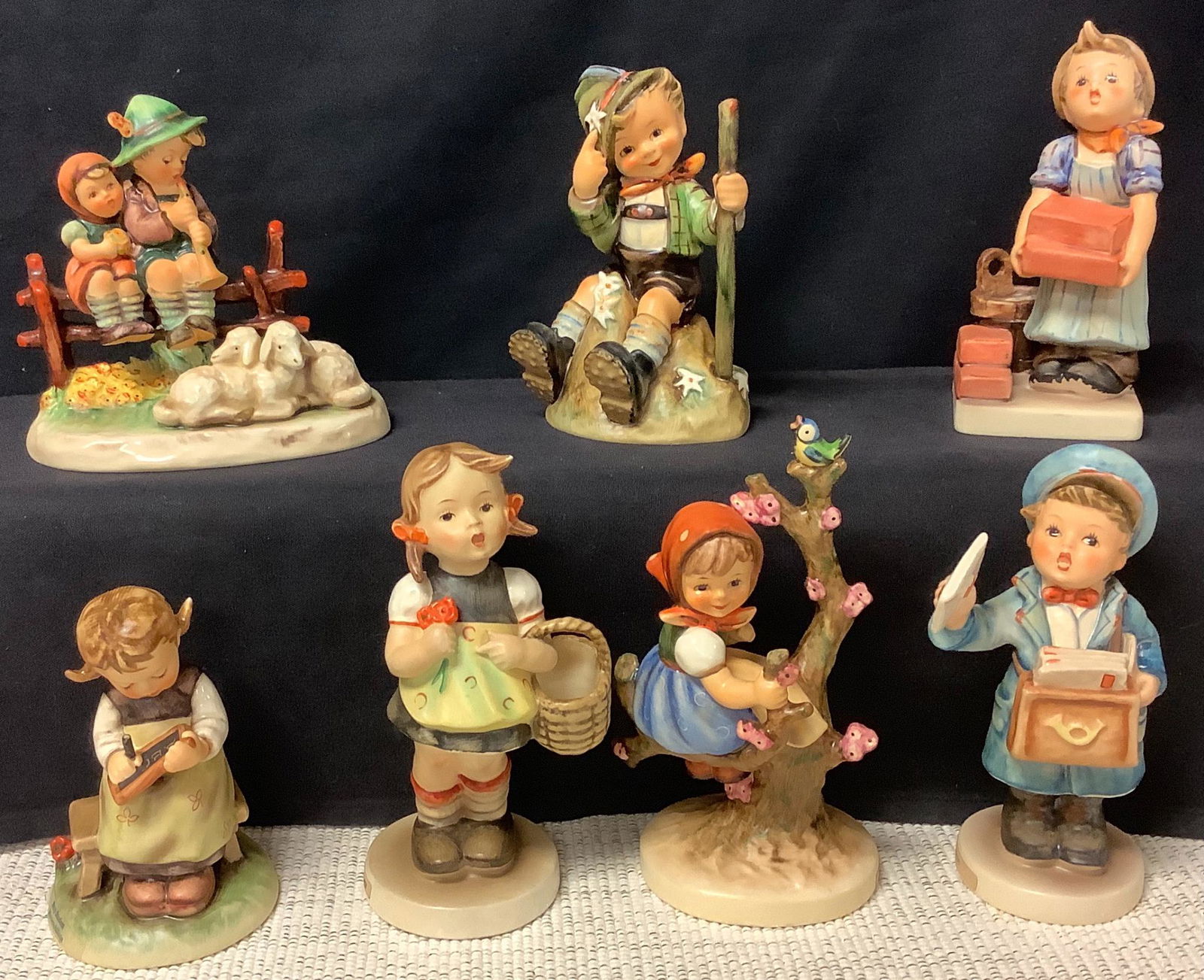 Lot of 7 Hummels including busy student & postman. One (1 of 5)