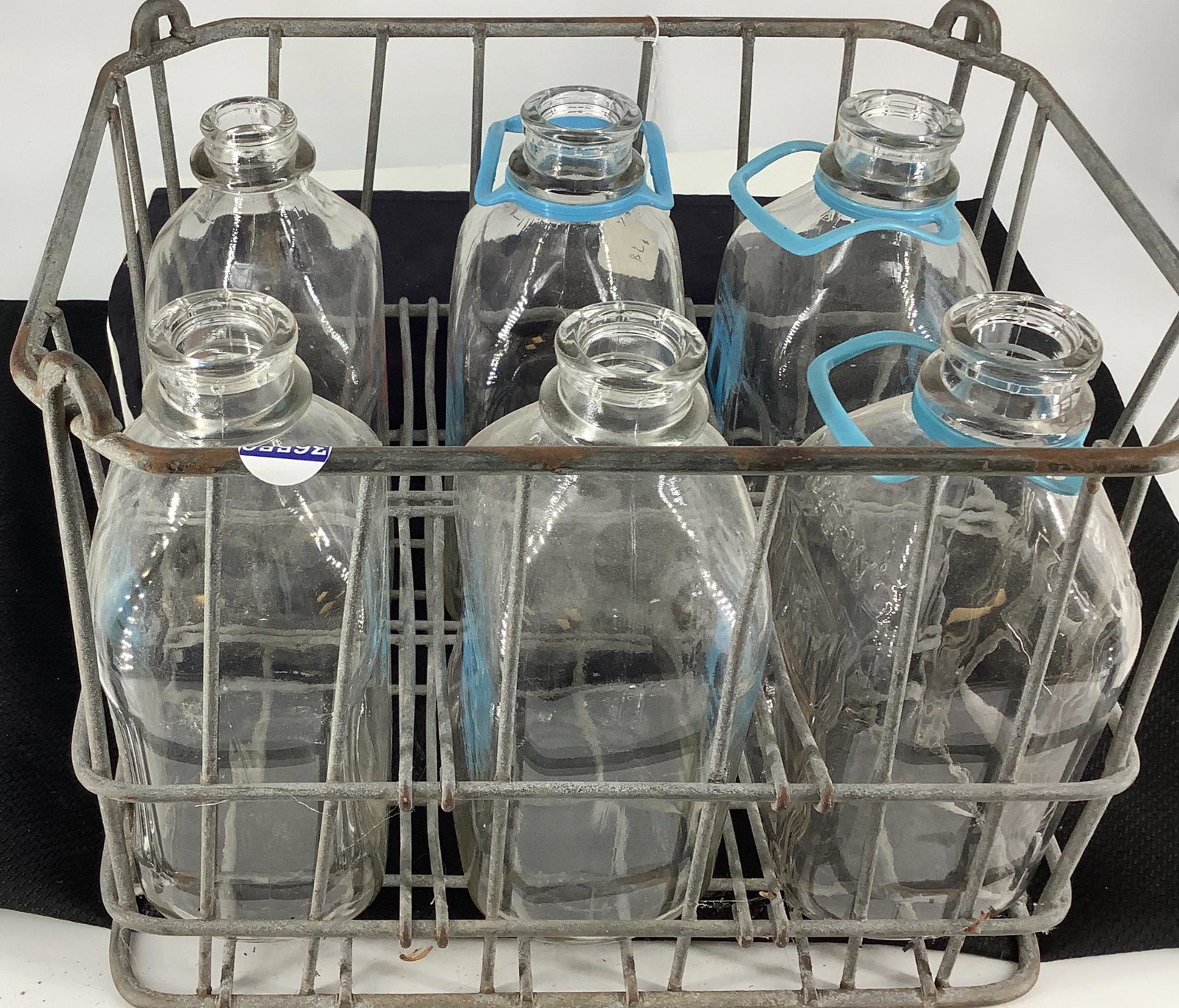 Six bottle crate for holding glass milk jugs.: Six bottle crate for holding glass milk jugs.