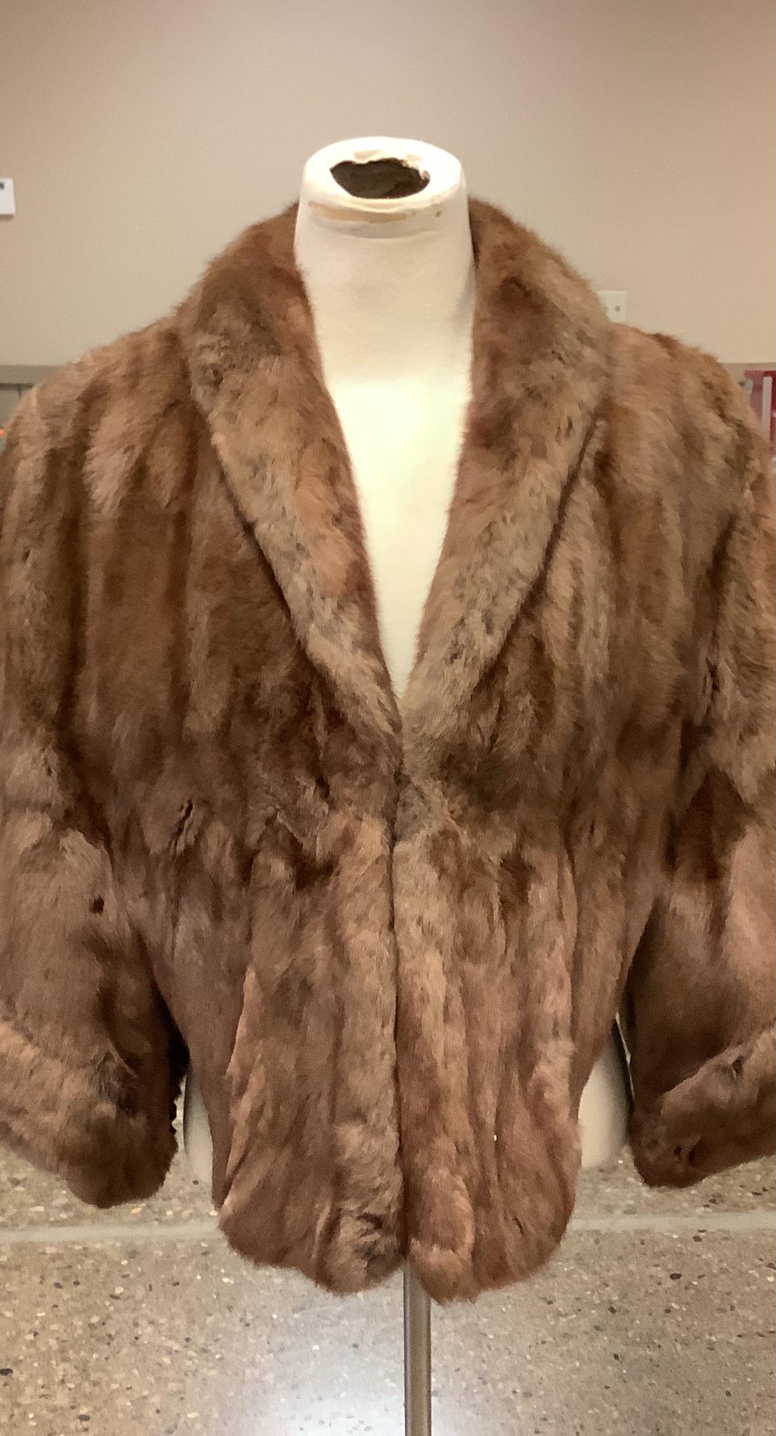 Brown mink stole some wear is showing.: Brown mink stole some wear is showing.