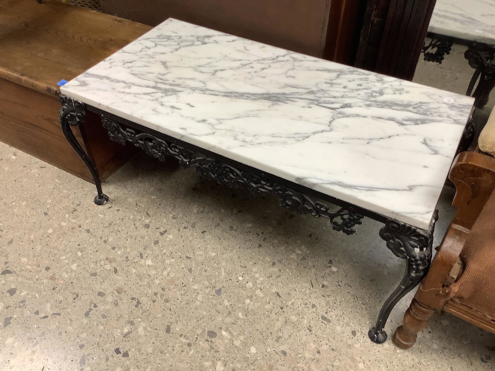 Wrought iron and marble coffee table: Wrought iron and marble coffee table