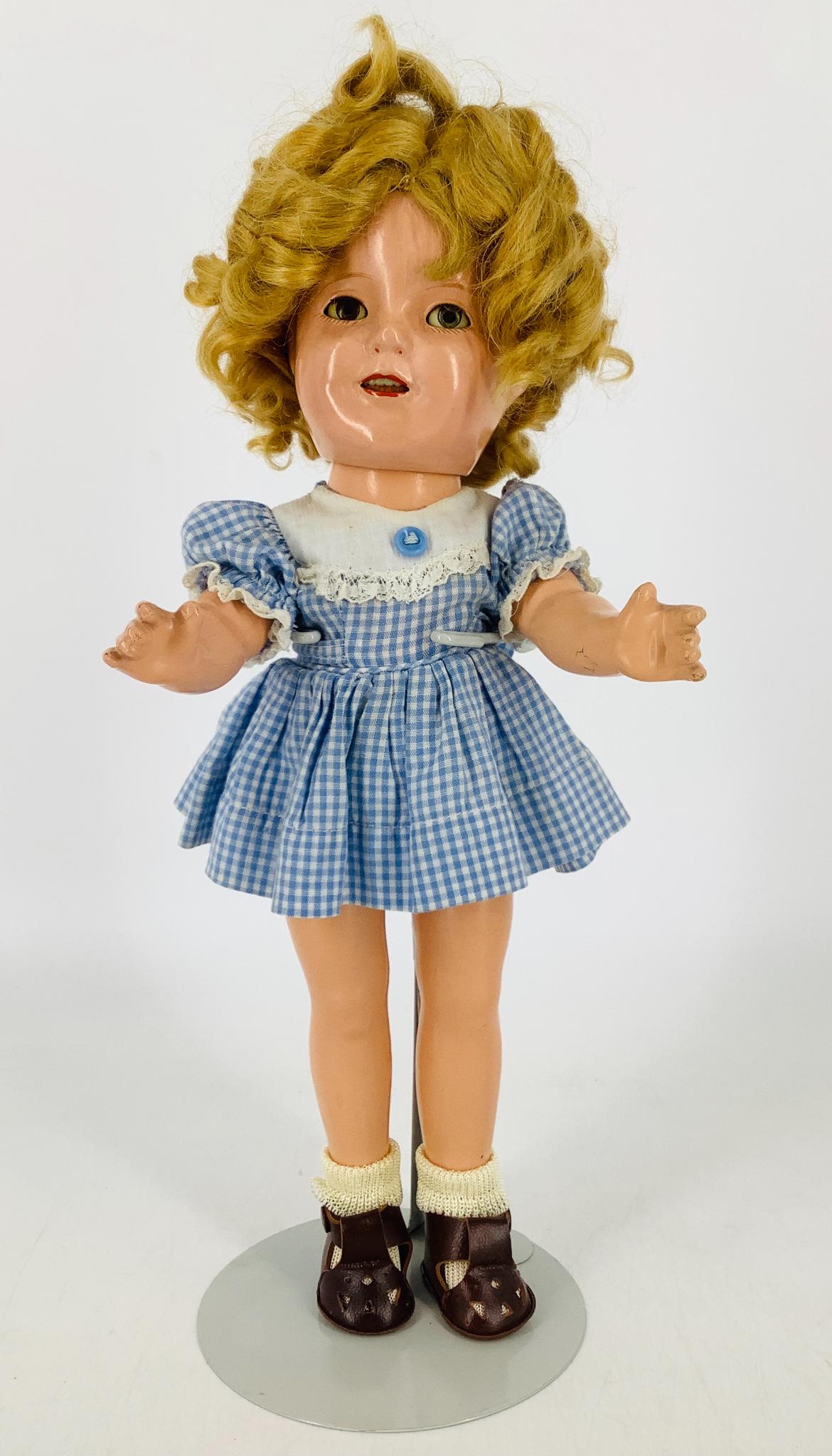 13" Ideal composition Shirley Temple. Mohair wig, sleep: 13" Ideal composition Shirley Temple. Mohair wig, sleep eyes, open mouth with teeth, on five-piece body. Head and body are marked "Shirley Temple 13". Wig needs to be restyled, eyes are clear, light o