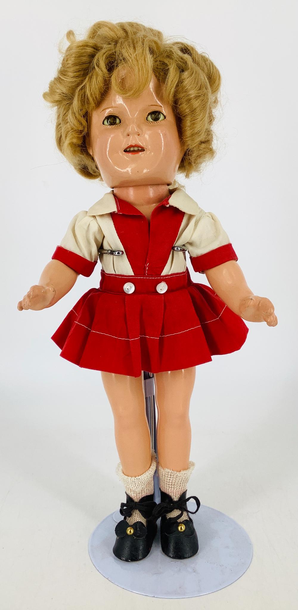 13" Ideal composition Shirley Temple. Mohair wig, sleep: 13" Ideal composition Shirley Temple. Mohair wig, sleep eyes, open mouth with teeth, on five-piece body. Head and body marked "Shirley Temple 13". Wig needs to be reset, eyes are cloudy, light overall