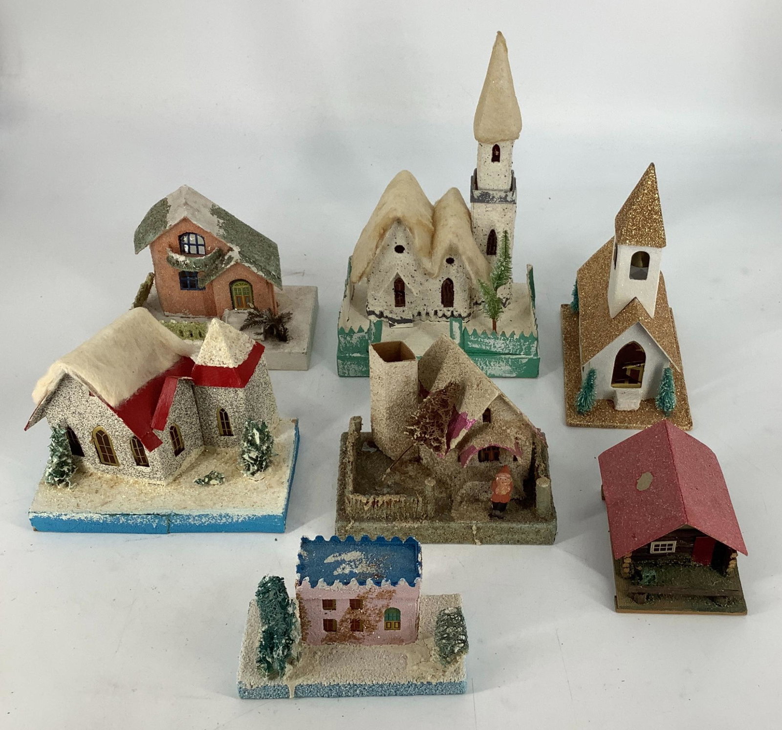 Antique 7-piece paper village set. Marked made in (1 of 3)