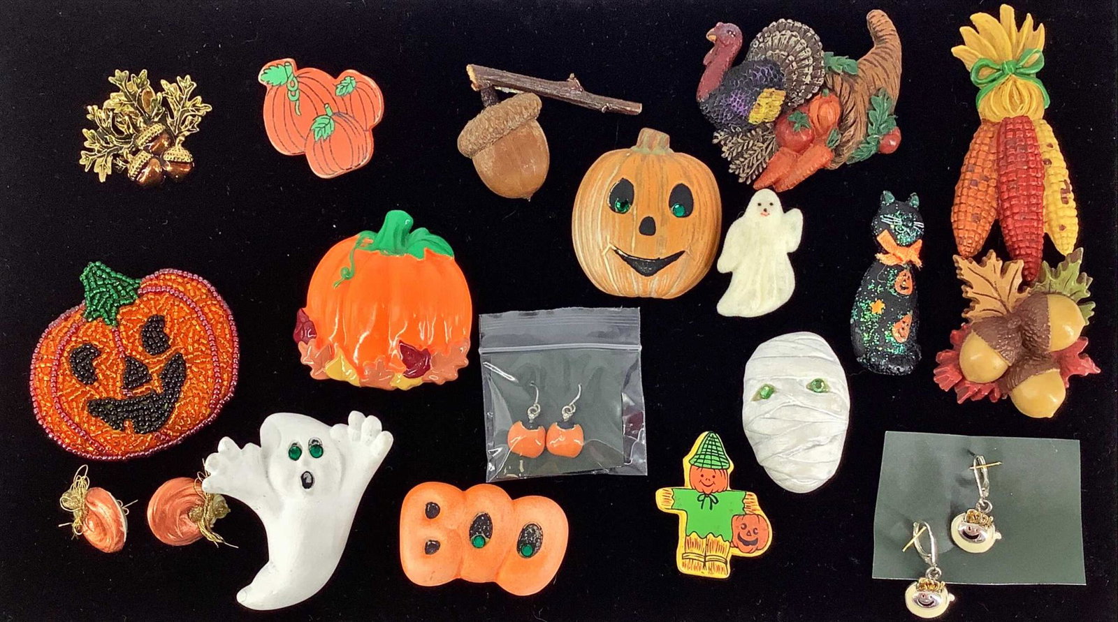 Box Lot Of Halloween & Fall Accessories: Box Lot Of Halloween & Fall Accessories 2.52" x 2.5" pumpkin patch made of seed beads, 1.85" mummy pin, 2" black cat pin, a pair of post back earrings with a pumpkin motif, 3.32" corn pin, 2.55" ghost
