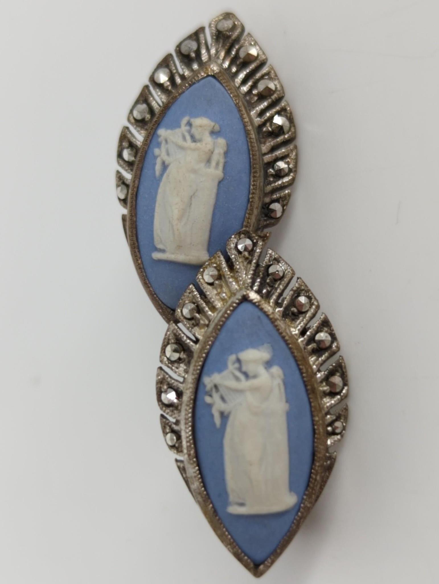 Sterling and China Cameo Earrings: Sterling and China Cameo Earrings Stamped and tested silver (925), lever back closures, measure 23.0mm x 12.75mm in size, marcasite adorned, cameo features figural female musician design playing lyre 