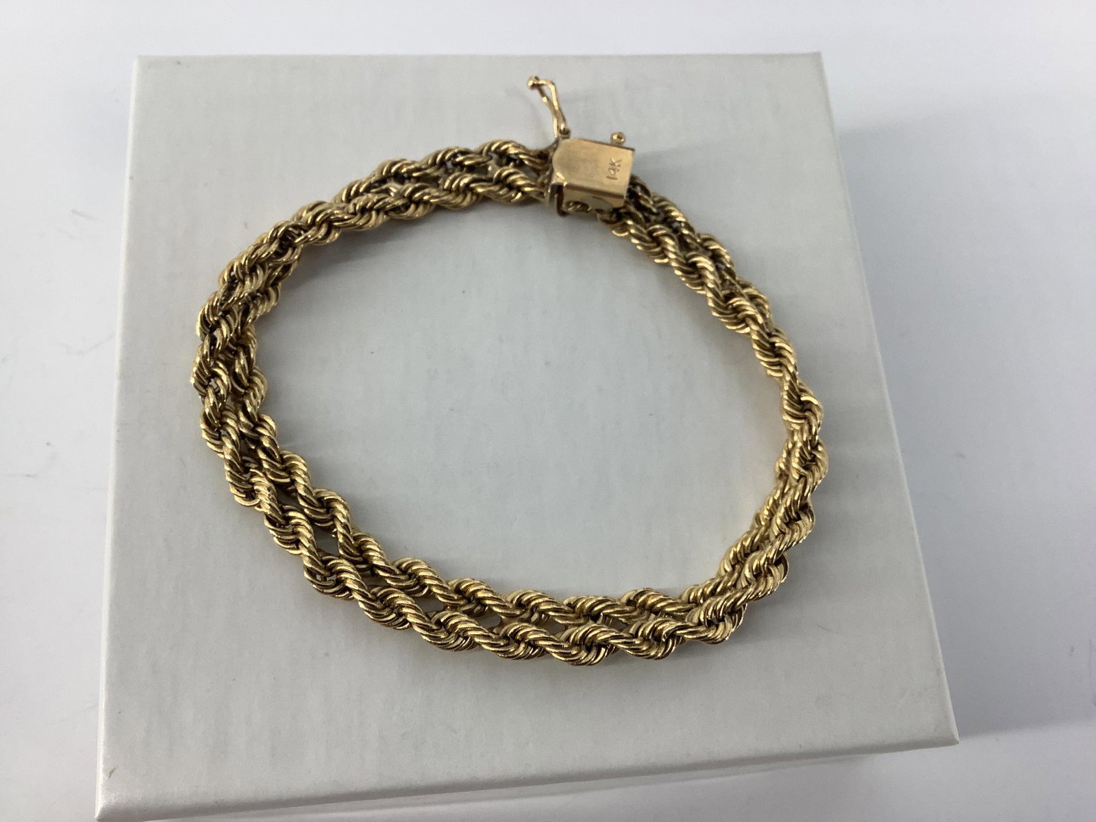 14kt Gold Bracelet: 14kt Gold Bracelet Stamped and tested 14kt yellow gold, vintage age, twin spiral chains design, box clasp closure, 7.5" in total length. 11.1 grams total weight.