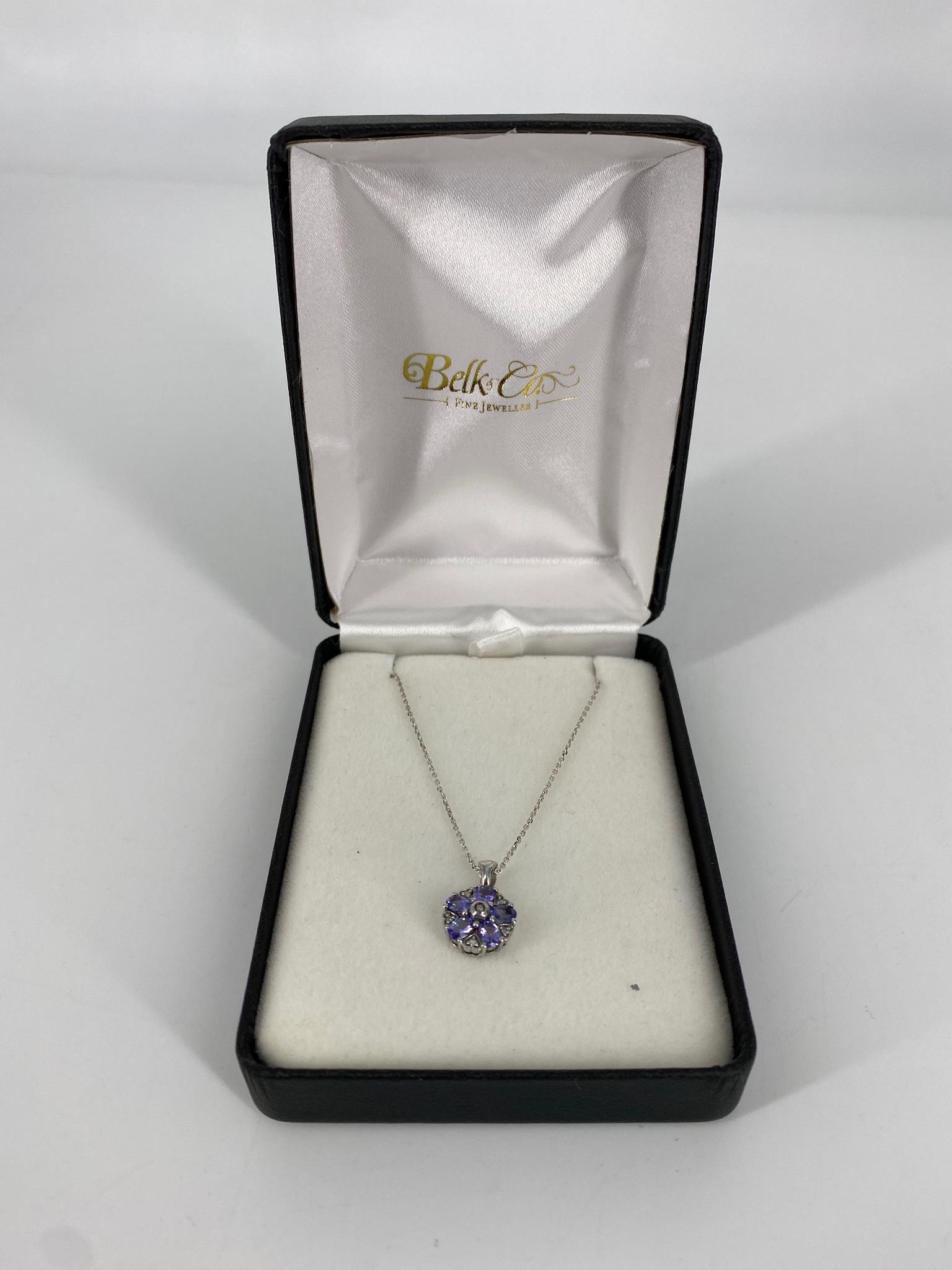Sterling Necklace with Tanzanite and Diamond Pendant: Sterling Necklace with Tanzanite and Diamond Pendant Belk & Co., 17" princess length chain with spring ring clasp, gemstone cluster pendant with tanzanite and diamond gemstones measuring up to 4.0mm i
