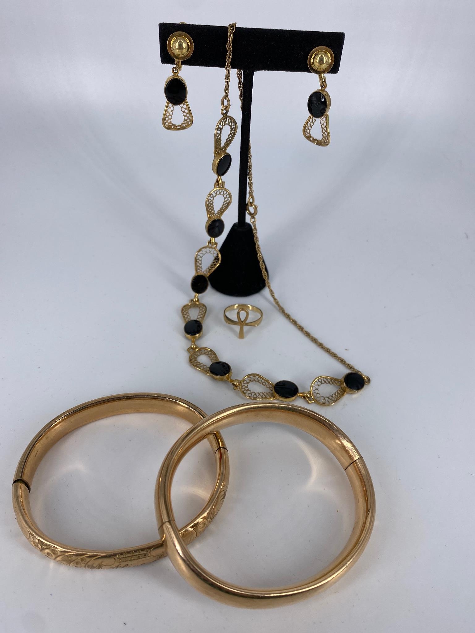 Vintage Gold Filled Accessories: Vintage Gold Filled Accessories This lot includes a gold filled onyx jewelry set that includes a choker length necklace with a spiral chain and openwork filigree style center links with onyx inlay and