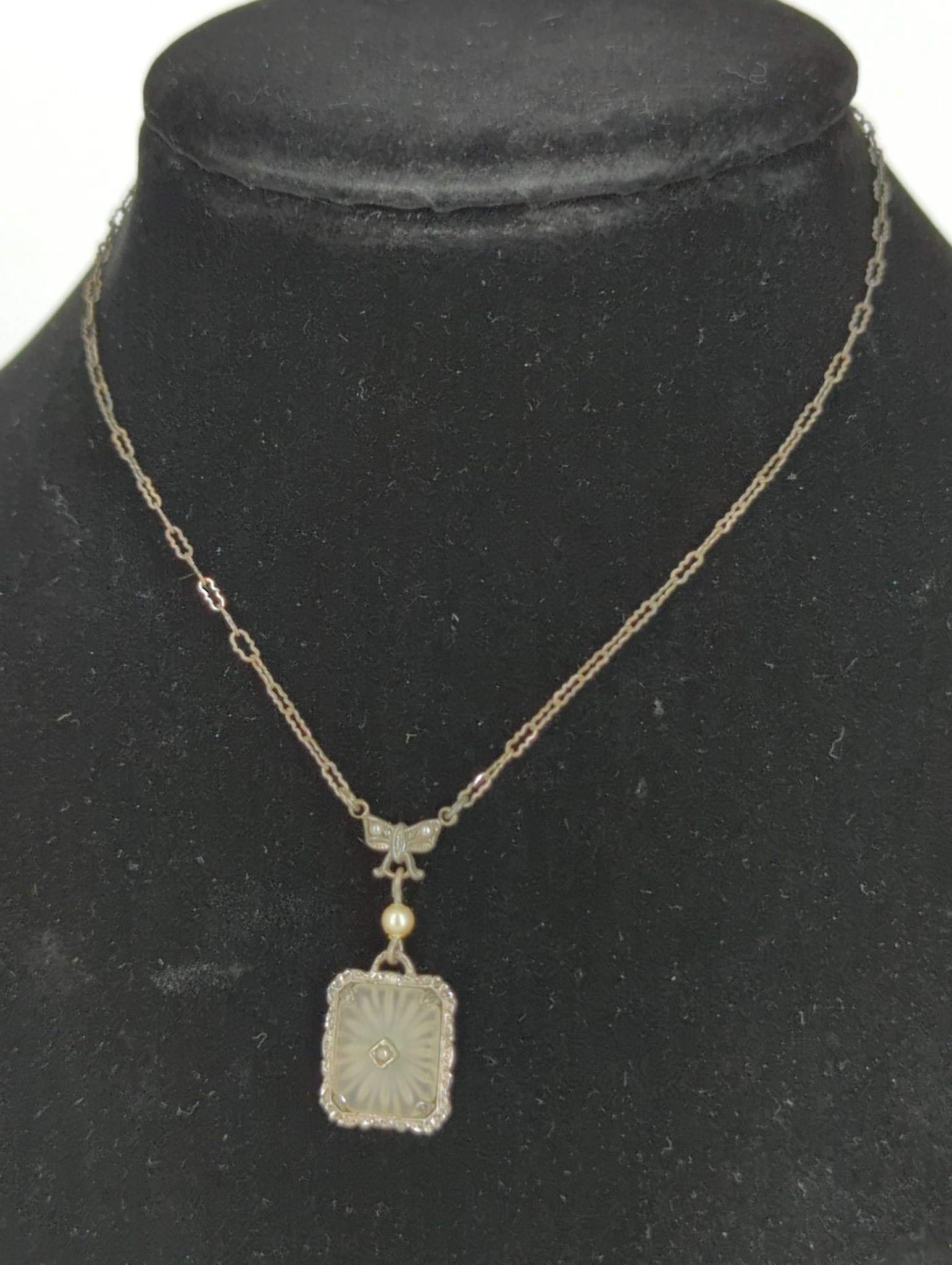 Vintage Sterling Necklace with Pendant: Vintage Sterling Necklace with Pendant Sterling silver chain, 12" choker length, spring ring clasp closure, vintage age, clear pendant with starburst motif measuring 14.5mm x 12.75mm in size.