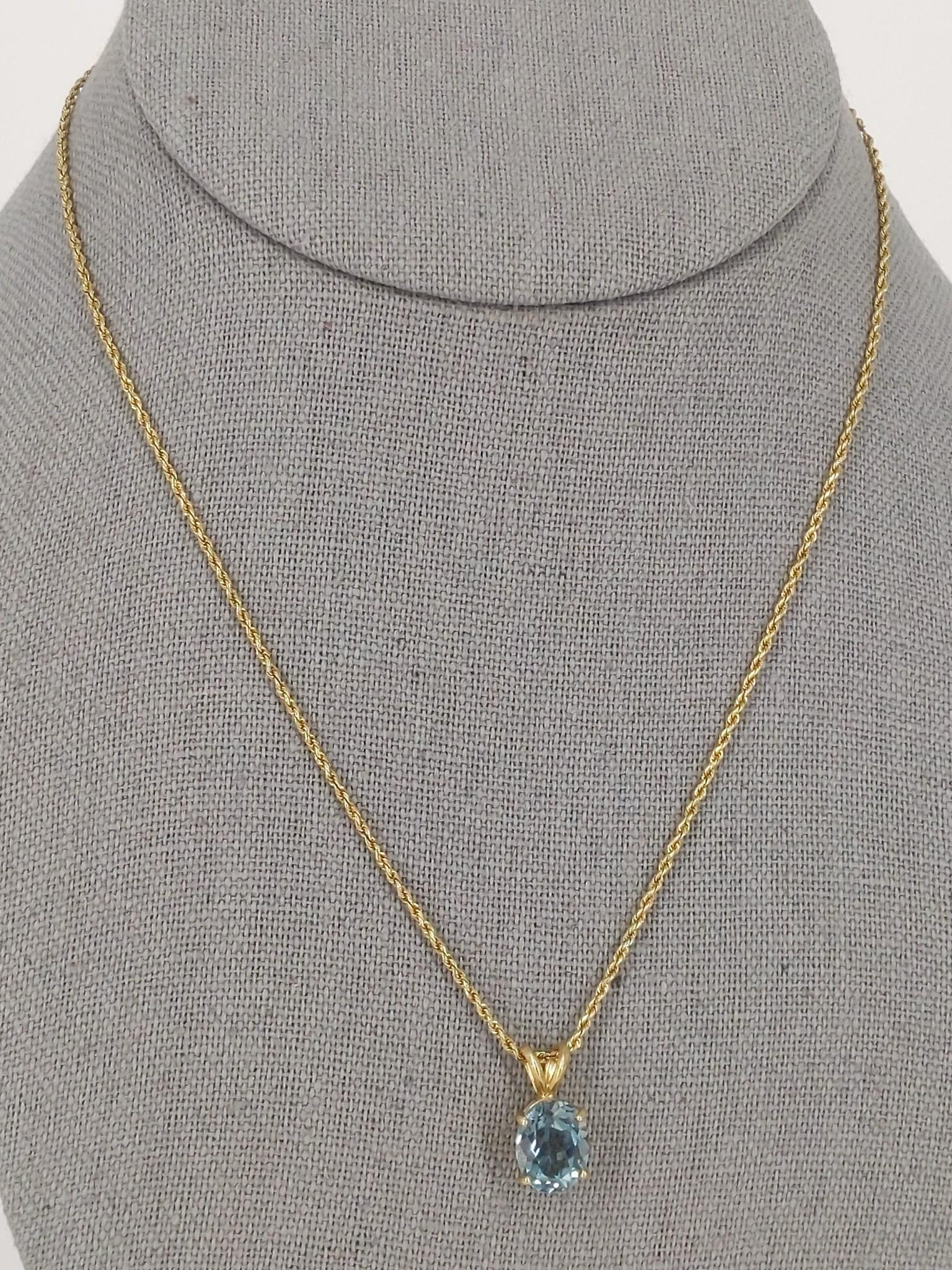 14kt Gold Necklace with Gold Pendant ft. Blue Topaz: 14kt Gold Necklace with Gold Pendant ft. Blue Topaz Gemstone 16" choker length chain (spiral) with lobster hook clasp closure, stamped and tested 14kt yellow gold, 4.2 grams total weight, oval cut blu