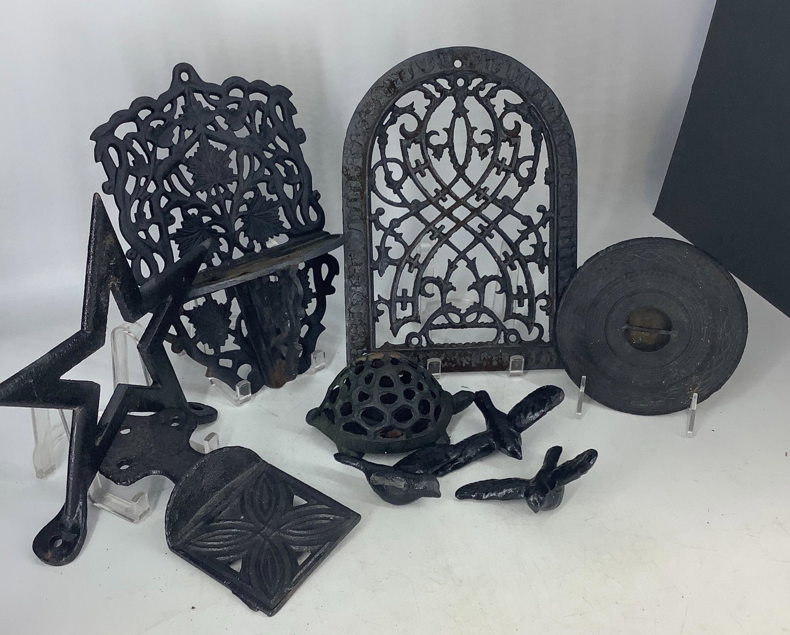 Lot of cast iron decorator pieces as shown. Includes: Lot of cast iron decorator pieces as shown. Includes turtle, 3 birds, Star, wall shelf (11.5 x 8" marked as shown) and more. 9 pieces in all.