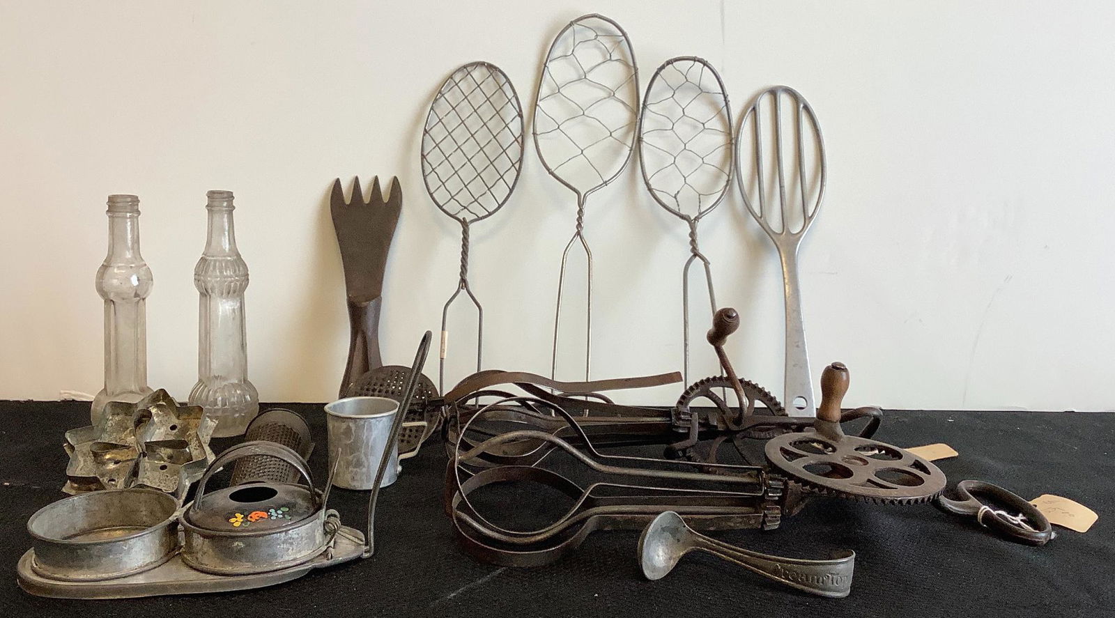 Vintage kitchen tools including 2 twisted wire: Vintage kitchen tools including 2 twisted wire spatulas/lifters, 1 welded wire spatula, 1 aluminum spatula marked Germany, 2 egg beaters, 2 spice graters, small aluminum cup marked "Maytao", 1 cookie