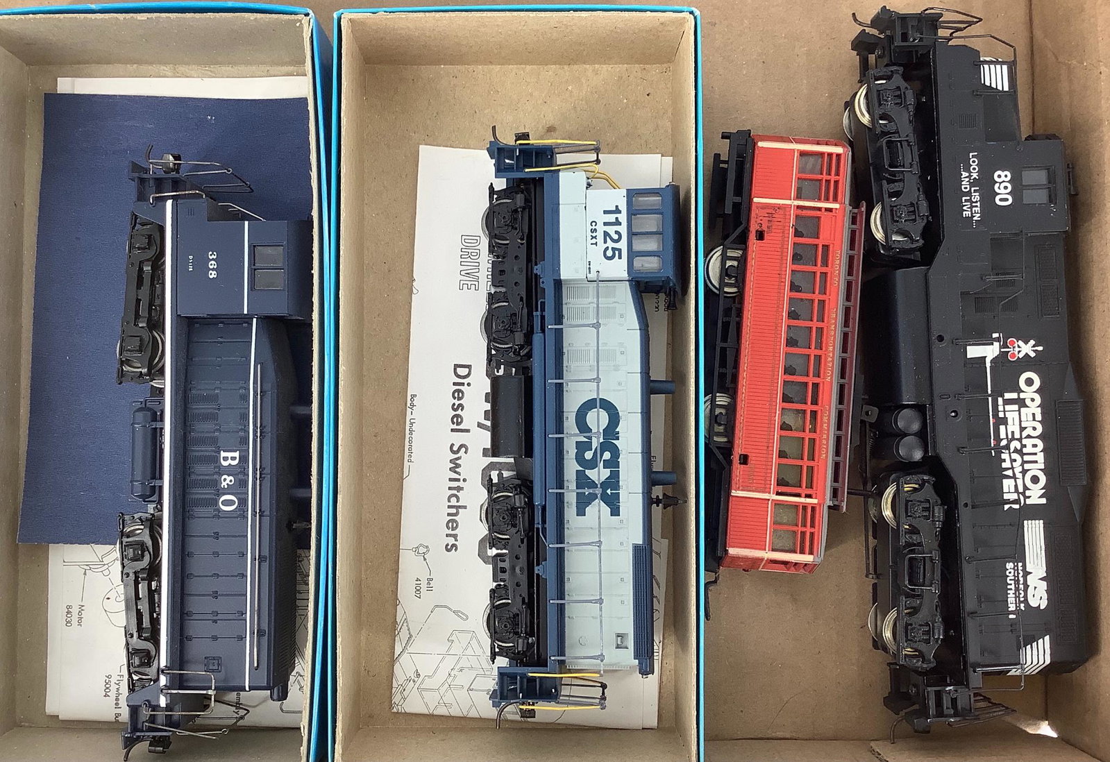 Three HO diesels and 1 trolley.: Three HO diesels and 1 trolley.