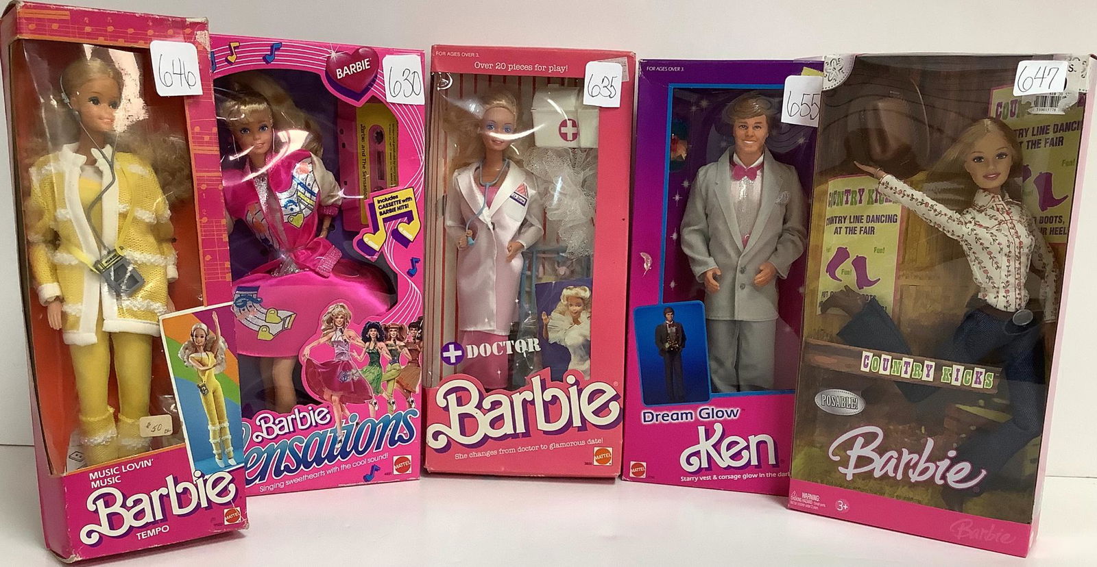 Lot of 5 Barbie's including Music Lovin' Barbie with: Lot of 5 Barbie's including Music Lovin' Barbie with stickers on box and box is in bad shape, Barbie and the Sensations Barbie with sticker on front and some box damage. Doctor Barbie with sticker on