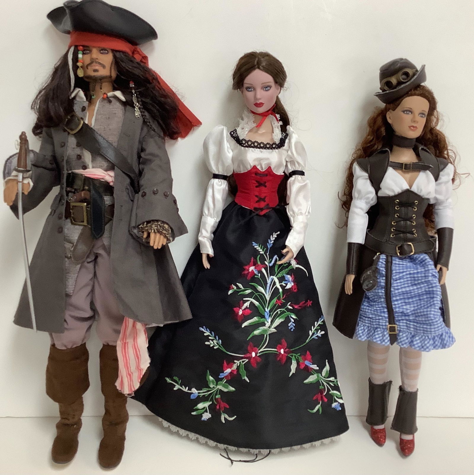 Lot of 3 including Disney's Captain Jack Sparrow of The: Lot of 3 including Disney's Captain Jack Sparrow of The Pirates of the Caribbean doll, and (2) Tonner dolls.