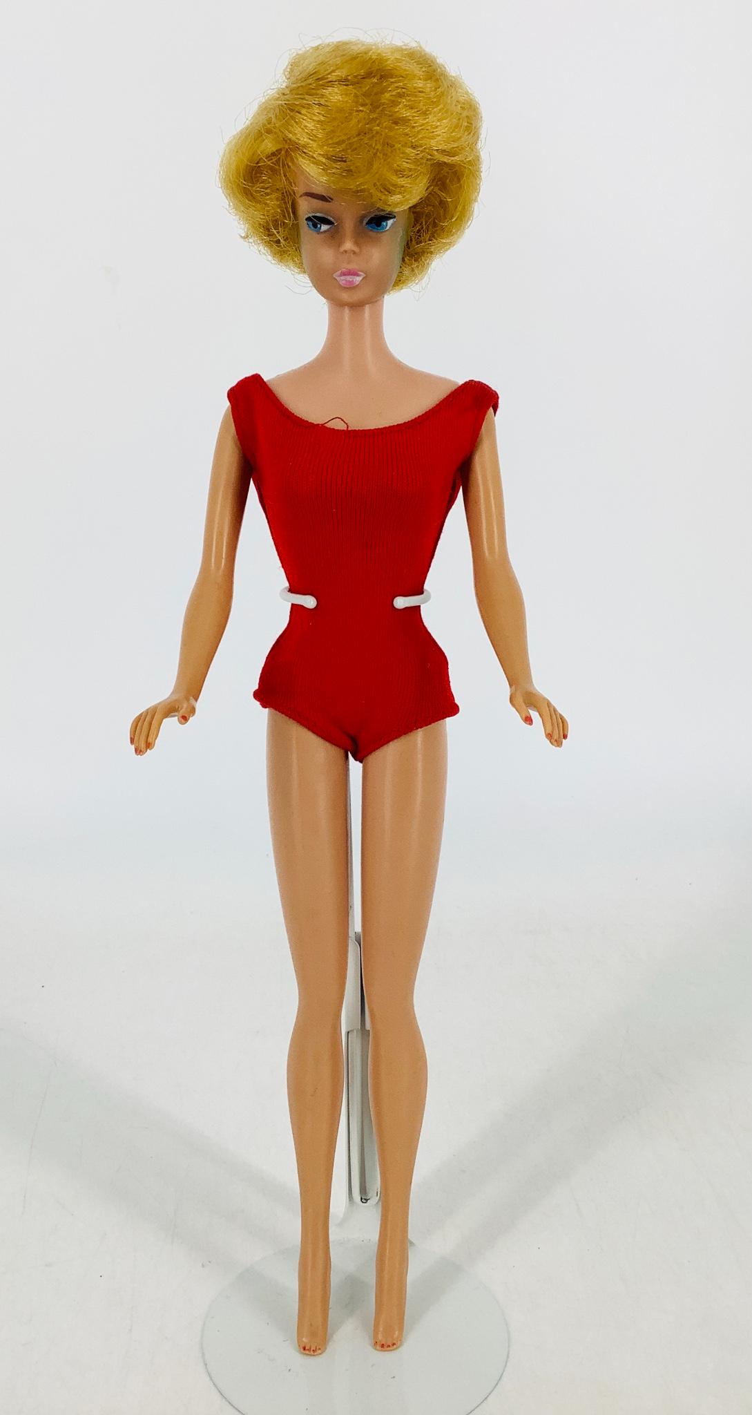 Blonde Bubble Cut Barbie wearing a red bathing suit. (1 of 4)