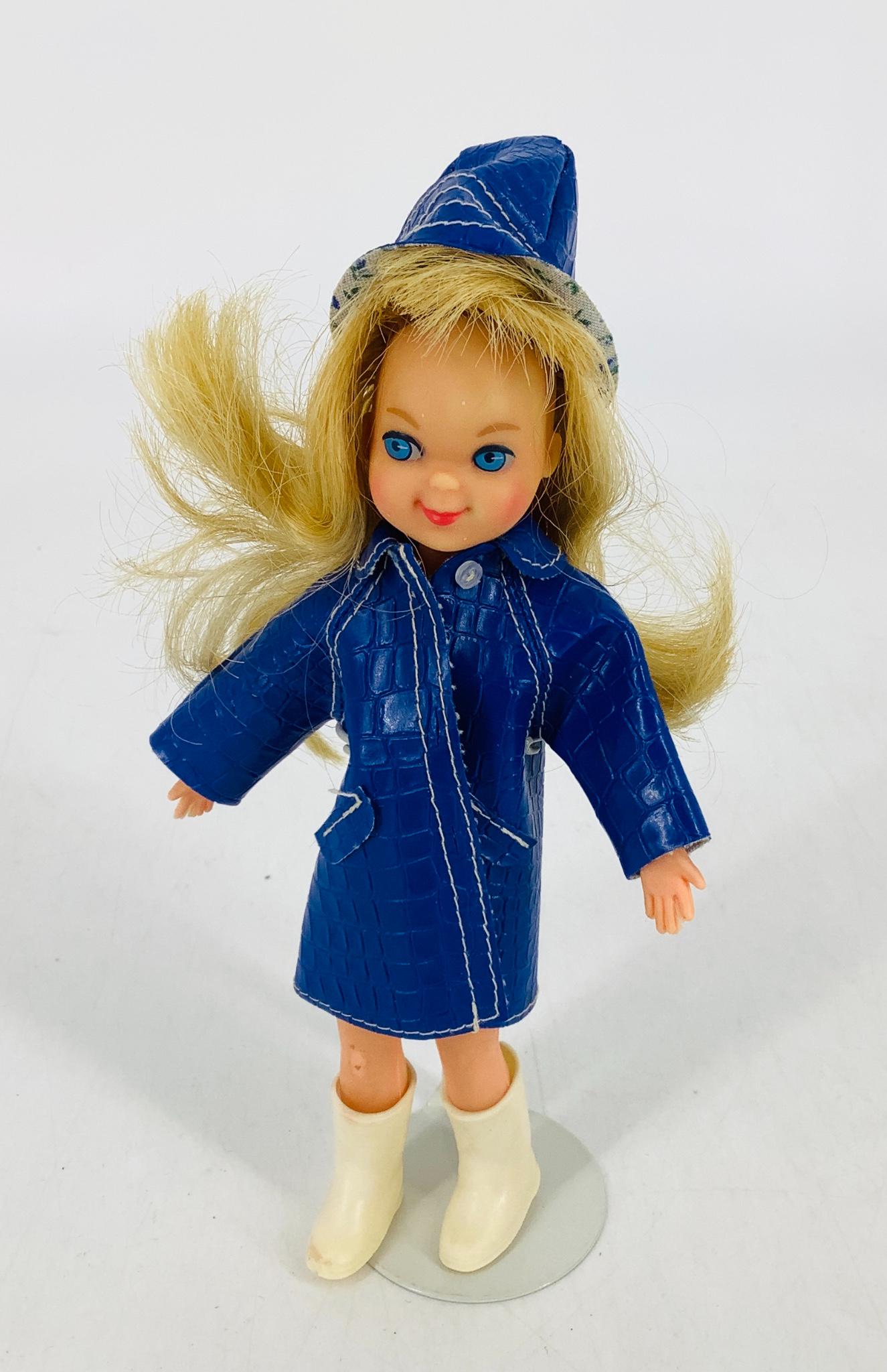 Blonde Tutti doll wearing puddle jumpers, raincoat and (1 of 3)