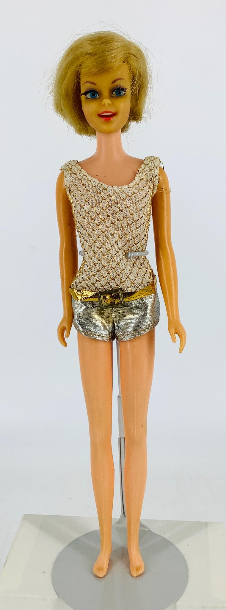 Blond haired Casey with her long rooted eyelashes &: Blond haired Casey with her long rooted eyelashes & beautiful toothy smile. Comes with her original swimsuit (some discoloration), sunglasses and her hanging triangle earring plus parts of another ear