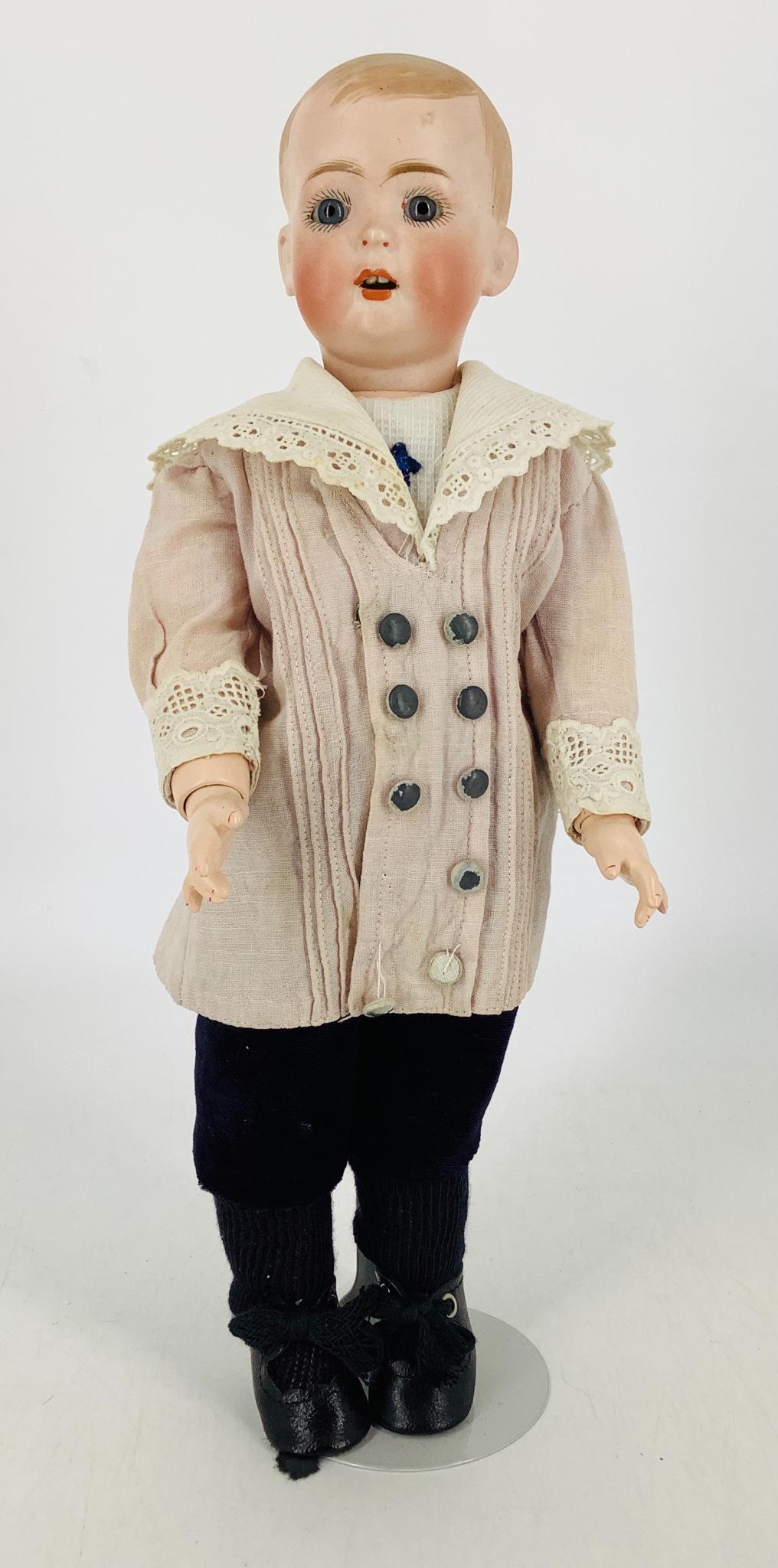 Bruno Schmidt 2096 bisque socket head "Tommy Tucker".: Bruno Schmidt 2096 bisque socket head "Tommy Tucker". 13" solid dome doll with molded and painted hair, stationary glass eyes, open mouth with two upper teeth, on newer jointed composition body. Nose