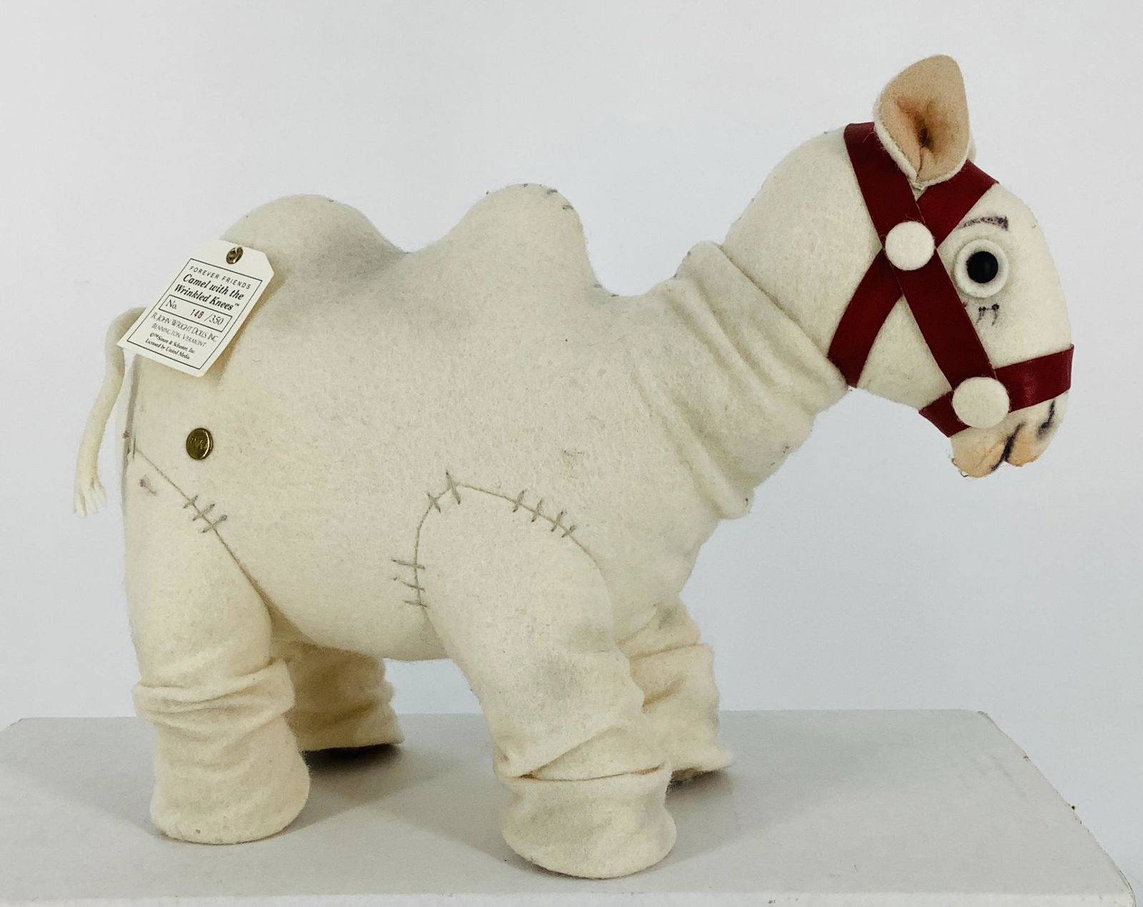 "Camel with the Wrinkled Knees" by R. John Wright. Part: "Camel with the Wrinkled Knees" by R. John Wright. Part of the Forever Friends series, 7 1/2" tall wool felt camel has applied ears, shoe button eyes and very wrinkly knees. He is made exclusively for