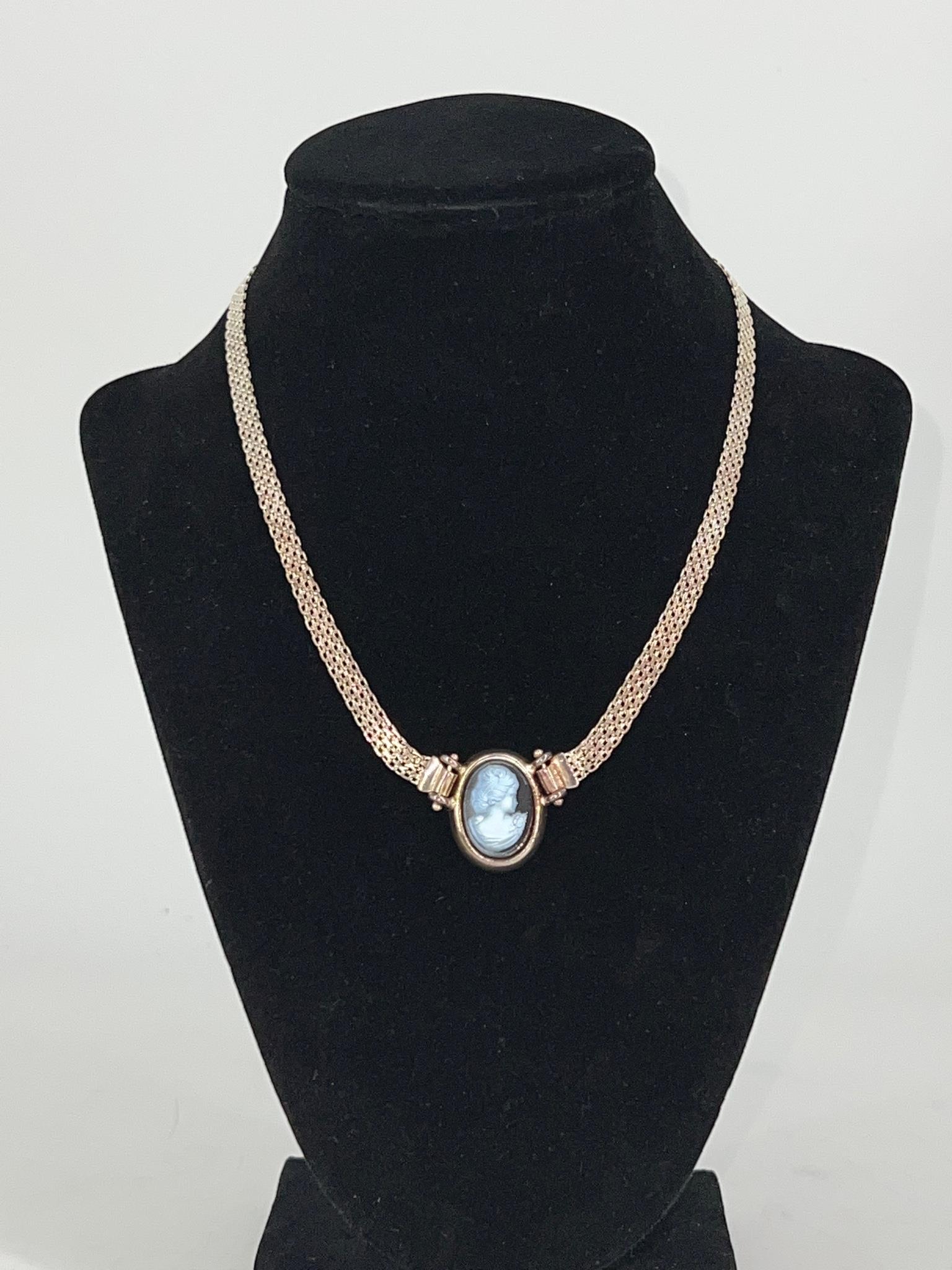 Sterling Necklace with Cameo Pendant: Sterling Necklace with Cameo Pendant Sterling silver (stamped and tested 925), 15" choker length, 0.495 troy ounces tw., signed Milor, made in Italy. Modern pressed cameo portrait pendant with right f