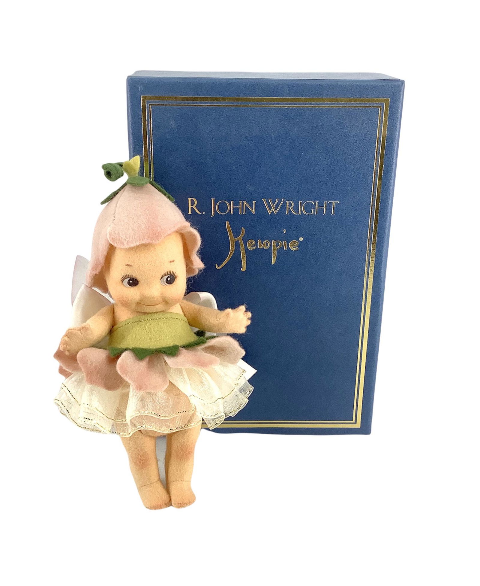 R. John Wright darling Kewpie themed doll titled: R. John Wright darling Kewpie themed doll titled "Fleur." DollÃ­s original hangtag included which identifies item as #049/250, doll is 6" tall and is five-jointed, circa 1999. Original box included.