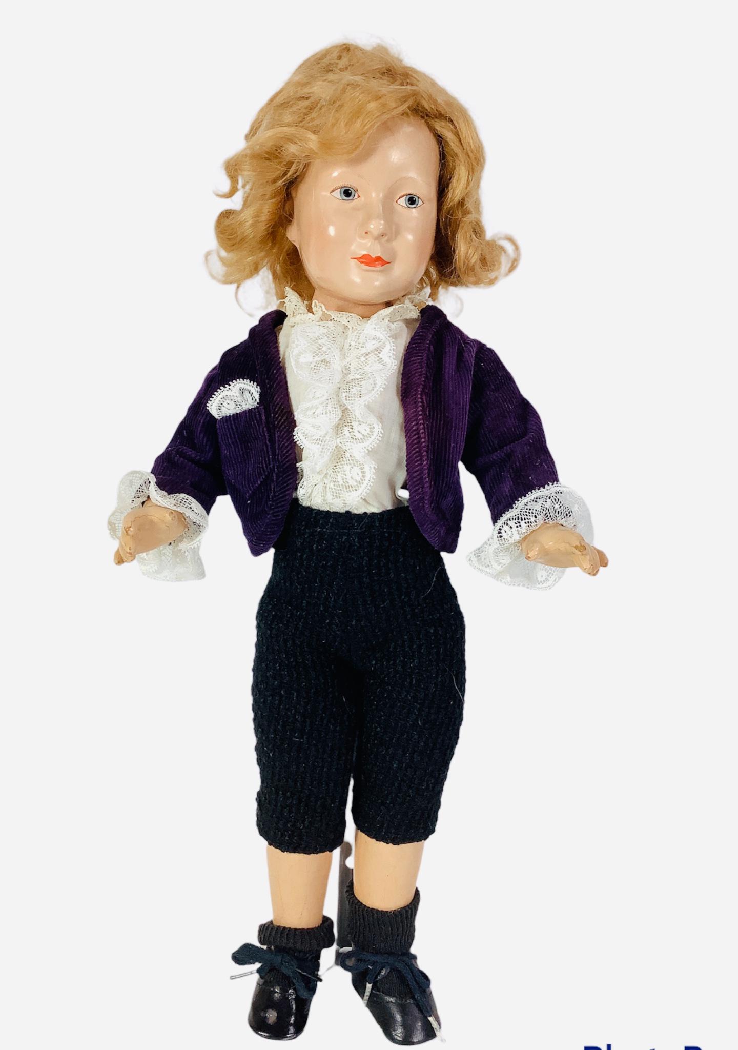 Unmarked Effanbee composition boy. 17" doll with molded: Unmarked Effanbee composition boy. 17" doll with molded and painted facial features, mohair wig, on five-piece body. Doll has overall crazing, redressed.