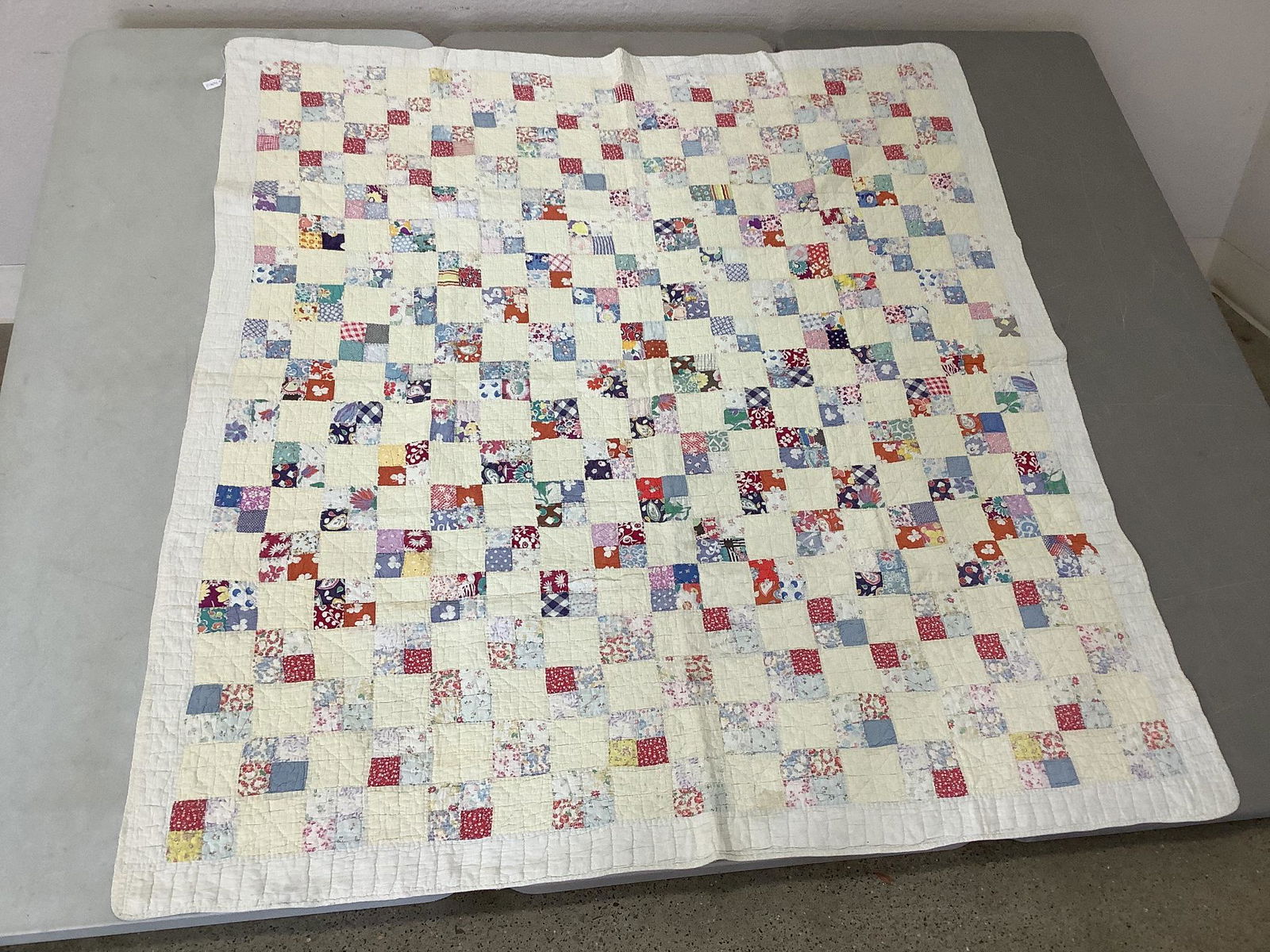 Patchwork lap quilt. Measures 70"x 63". Minor stains. (1 of 3)