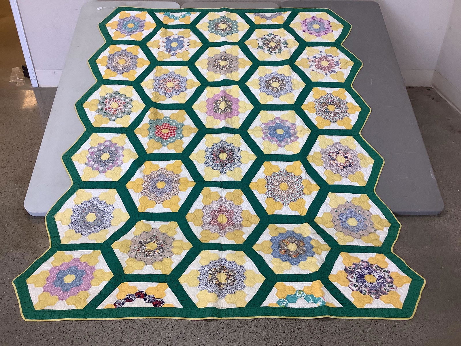 Grandmother's flower garden quilt. Measures 72" x 94". (1 of 3)