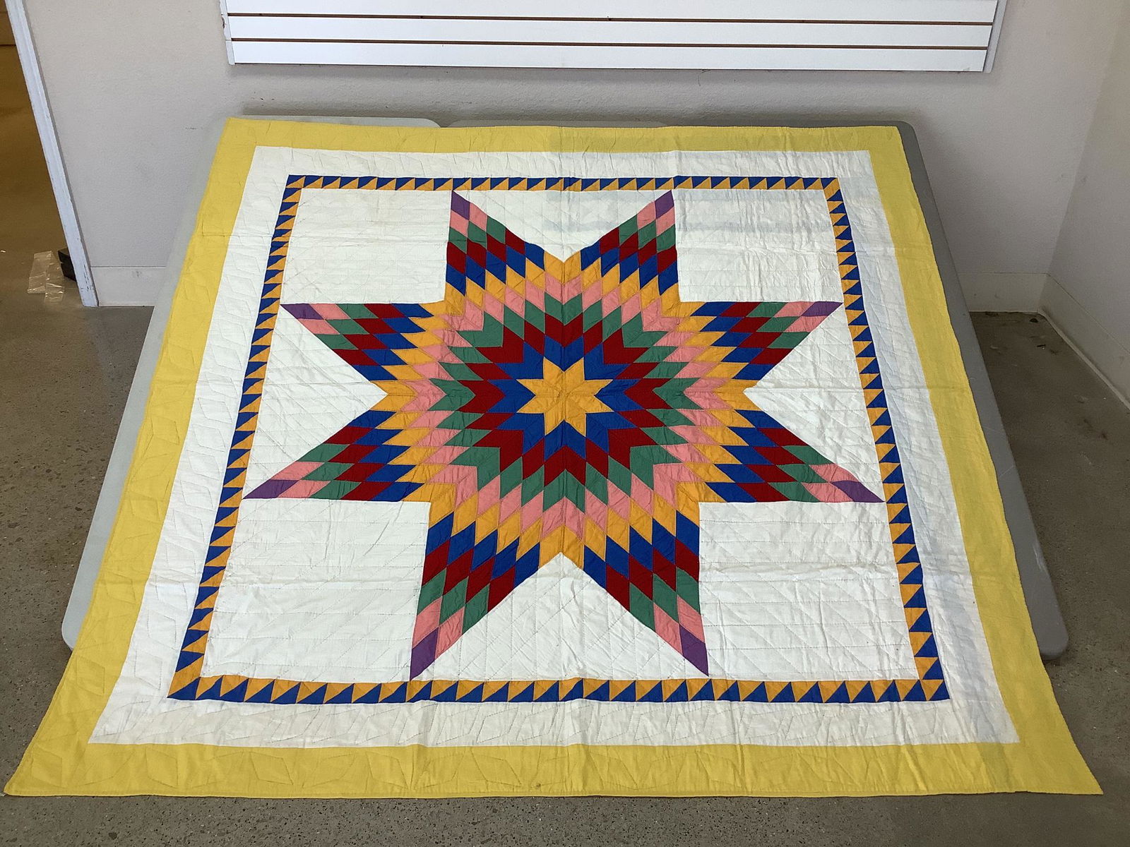 8 point starburst quilt. Measures 84" x84". Minor (1 of 3)