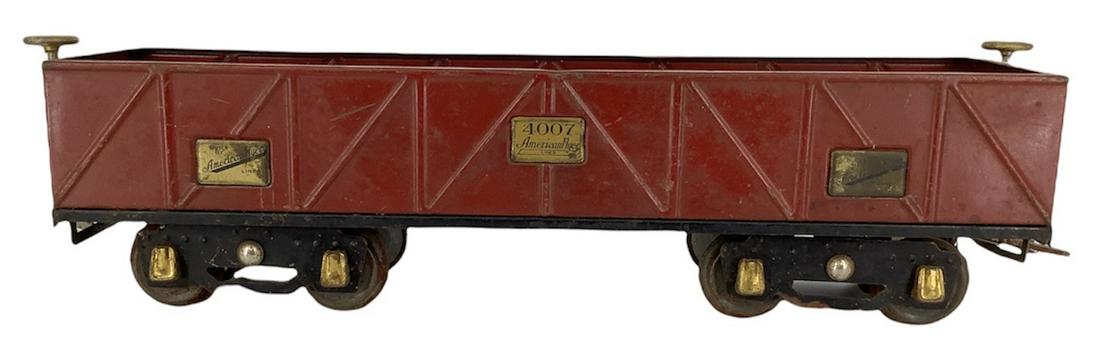 American Flyer standard gauge 4007 red gondola. Axle: American Flyer standard gauge 4007 red gondola. Axle bearing cover on one wheel has been replaced.