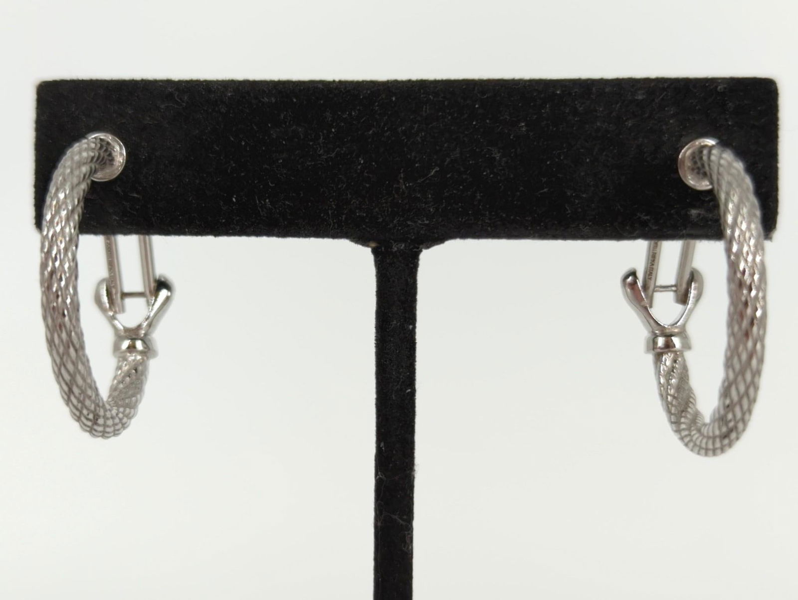 Pair Judith Ripka Sterling Hoop Earrings: Pair Judith Ripka Sterling Hoop Earrings 0.13 troy ounces tw., signed, stamped and tested 925, spiral design, made in Italy, 26.0mm in diameter.