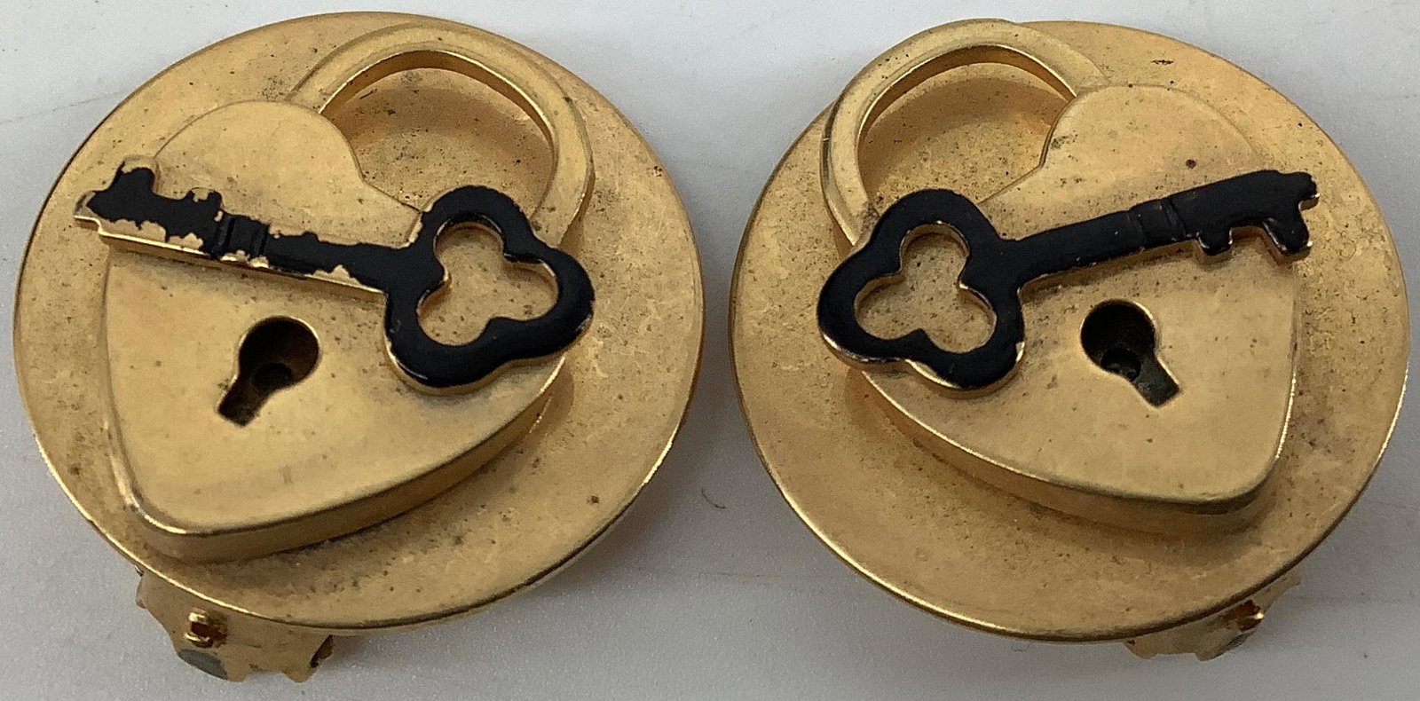 Pair Vintage Locket & Key Earrings: Pair Vintage Locket & Key Earrings 25.25mm in diameter, high relief design, age related wear including particular wear to the enameling on one key, lever back closures, unsigned, gold tone metal (base