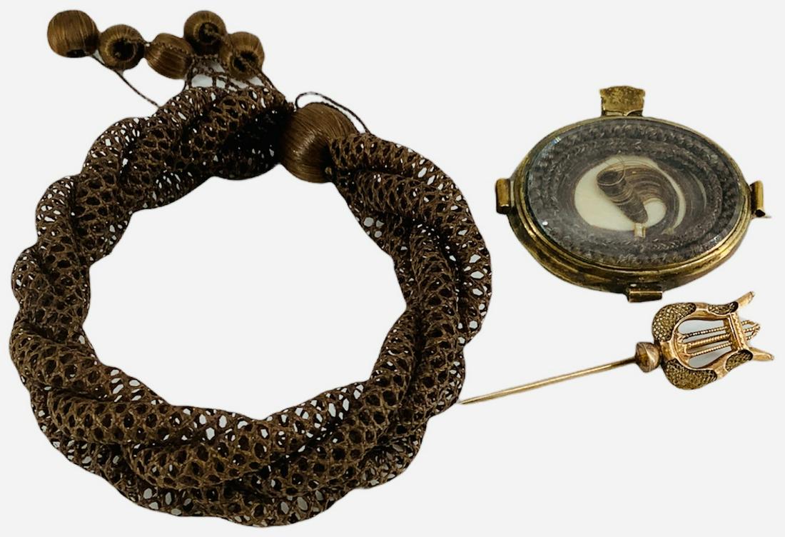Victorian Hair Jewelry: Victorian Hair Jewelry 41.5mm oval shape pin/locket with auburn hair inside, on gold-filled frame, with personalized engraving "To Mother" circa 1860 on reverse. Adjustable size antique drawstring bra
