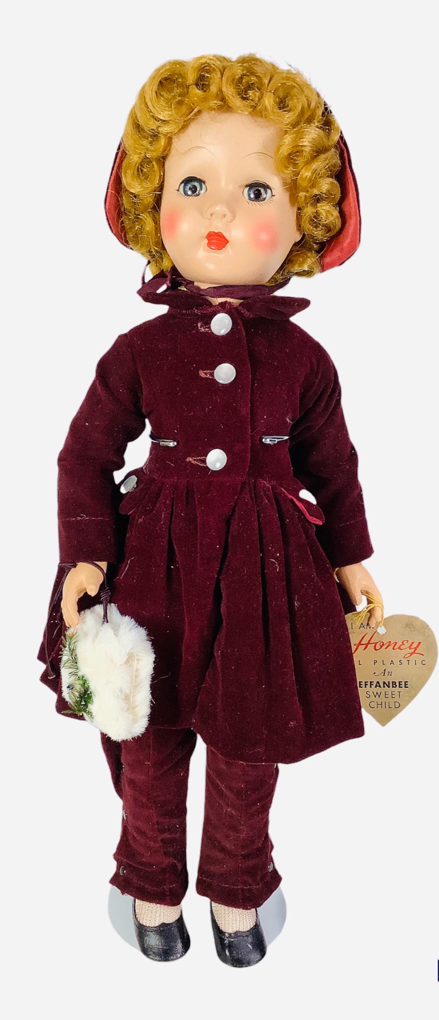 Effanbee hard plastic Honey Walker in box. 19" all original doll with saran wig, sleep eyes with: Effanbee hard plastic Honey Walker in box. 19" all original doll with saran wig, sleep eyes with eyelashes, closed mouth, on five-piece walker body. Honey wears her maroon velvet coat, snow pants, mat