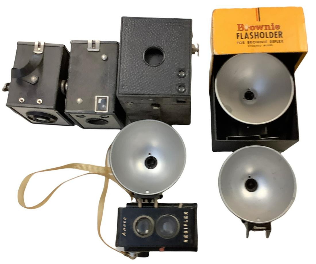 Lot of 4 vintage cameras and 2 flash holders, one in original box. (1 of 1)