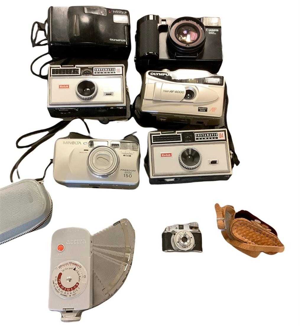 Lot of 7 vintage cameras include Canon,Olympus and a Ejector by Accura. (1 of 1)