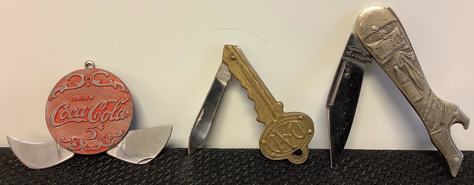 Three pocket knives: Coca Cola is 1.5" diameter (collapsed), Key marked Ã¬DAD" is 2.5", Ã¬Nehi" boot (1 of 1)