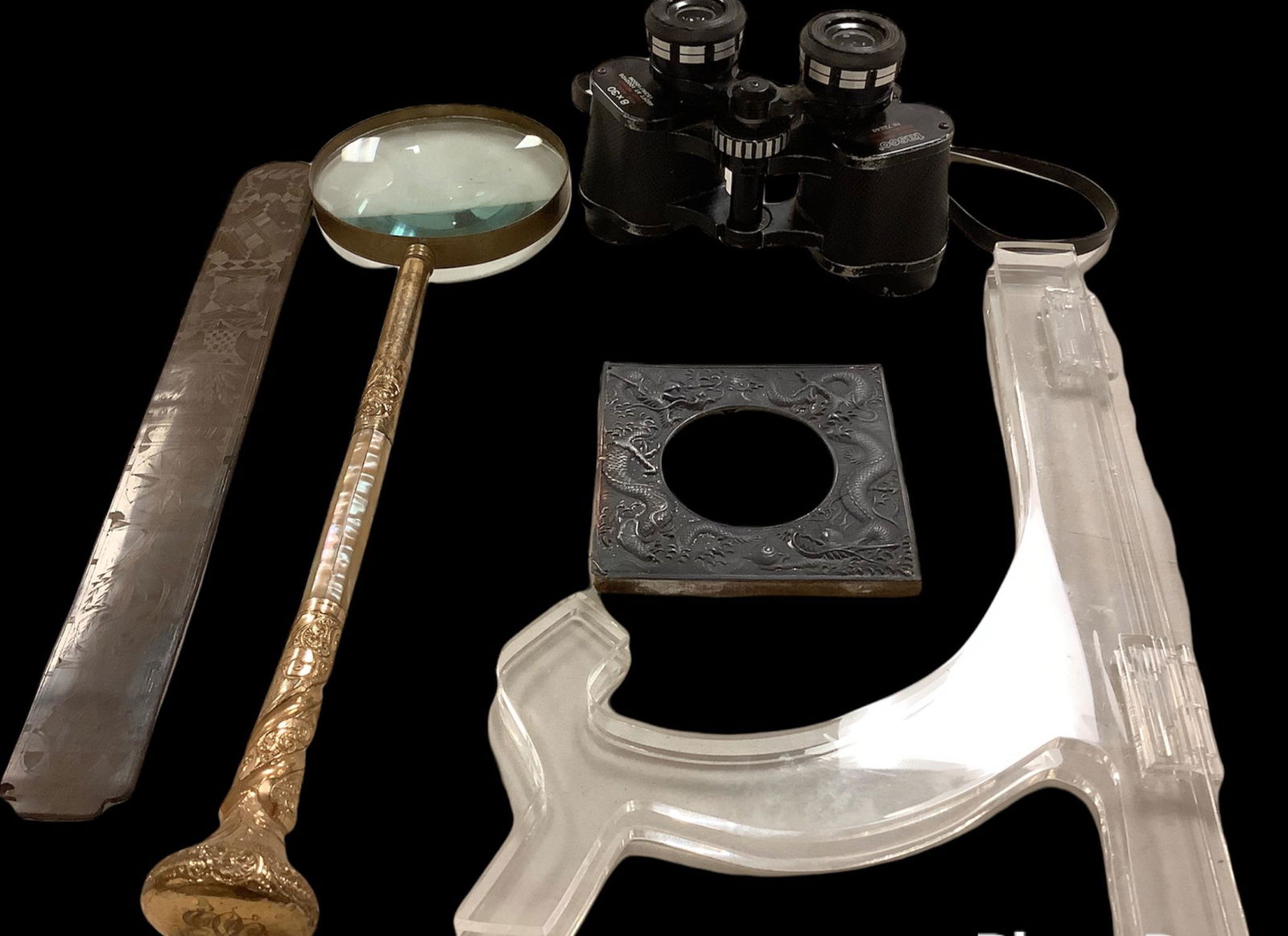 magnifying glass with handle 16 Ã¬long with mother of pearl. 4" high binoculars, large picture: magnifying glass with handle 16 Ã¬long with mother of pearl. 4" high binoculars, large picture stand. Carved plastic pedal 13" long. Small tote of old postcards, Some Asian. Picture frame with drago