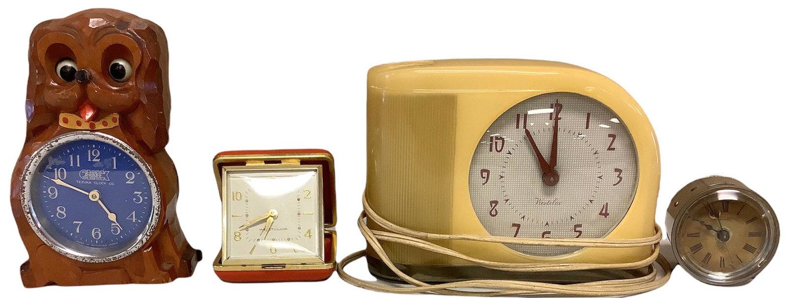 Lot of 4 clocks ranging in height from 2.25" - 6". (1 of 1)