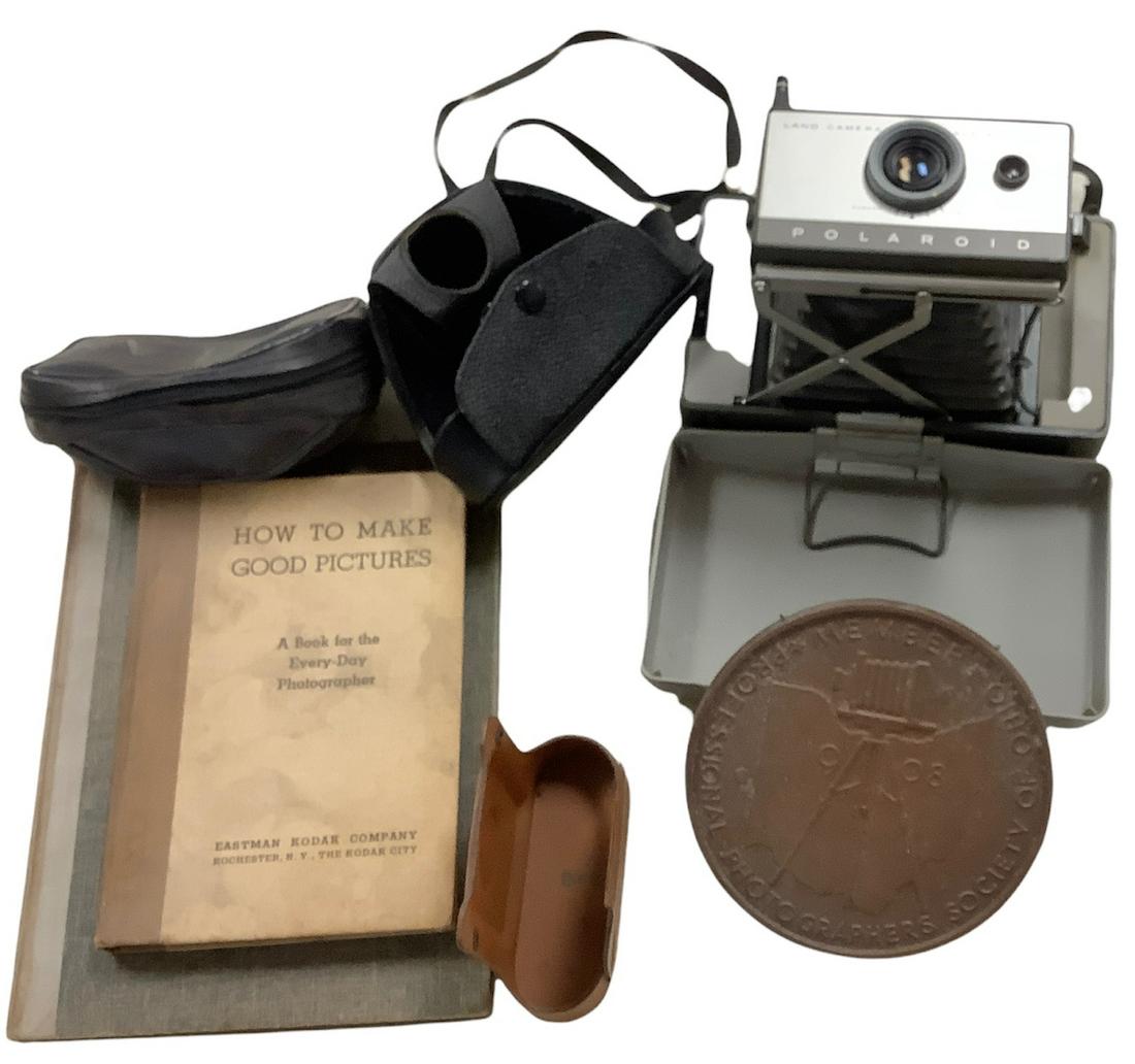 Lot of vintage photography items including 2 books, a land camera, 3 camera cases and a round.metal (1 of 1)