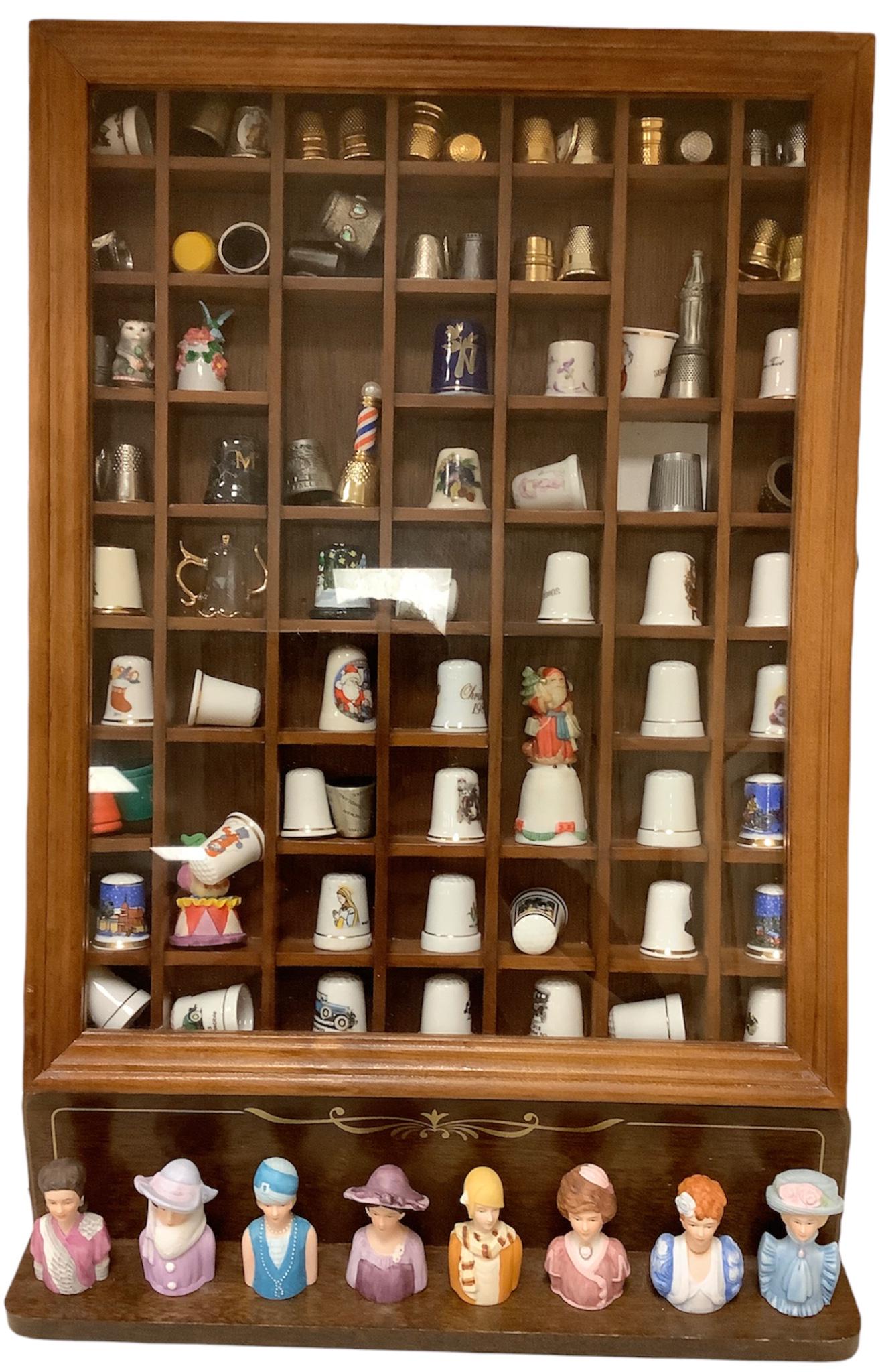 Lot of thimbles. Including 8 vintage Avon ladies on a wood shelf & 76 misc in shadow box: Lot of thimbles. Including 8 vintage Avon ladies on a wood shelf & 76 misc in shadow box