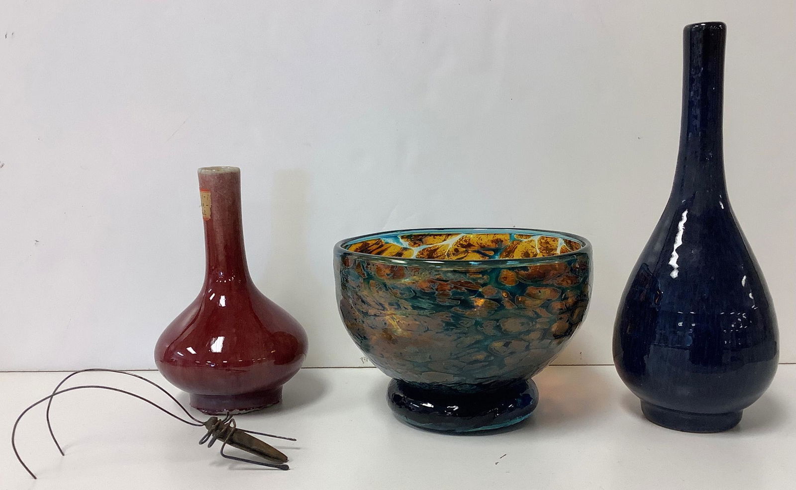 Asian red glazed bud vase with wax seal on bottom, many chips along bottom rim, 5"h. Blue glazed (1 of 3)