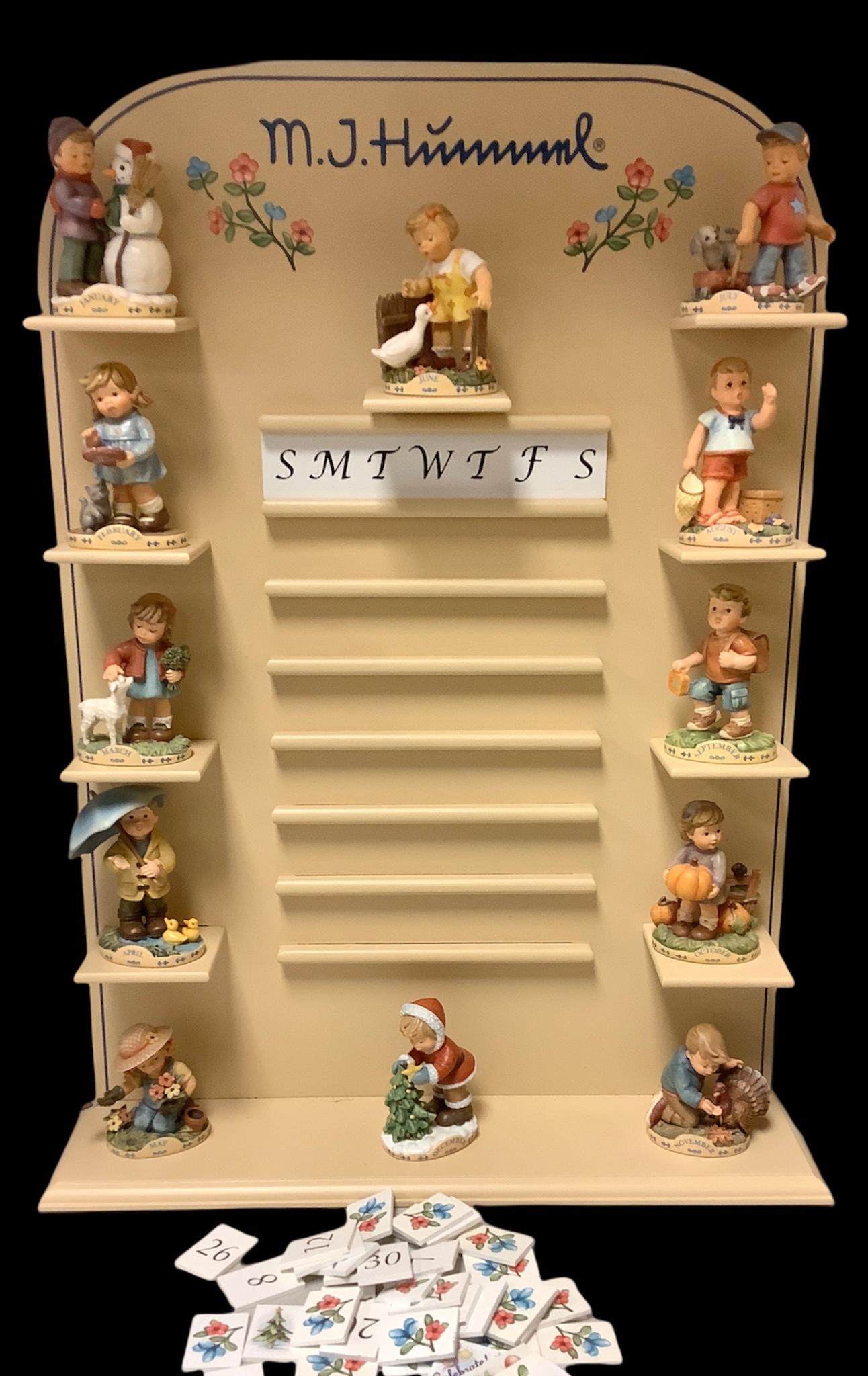 M J Hummel perpetual calendar with month figurines and date tiles made by Hallmark 2015. Measures 22 (1 of 1)