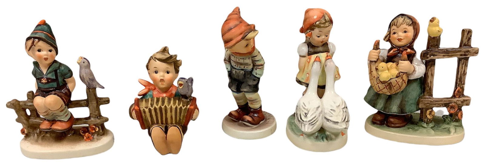 Lot of 5 Hummel figurines including Wayside Harmony, LetÃ­s Sing, Chicken-Licken, Goose Girl and (1 of 2)