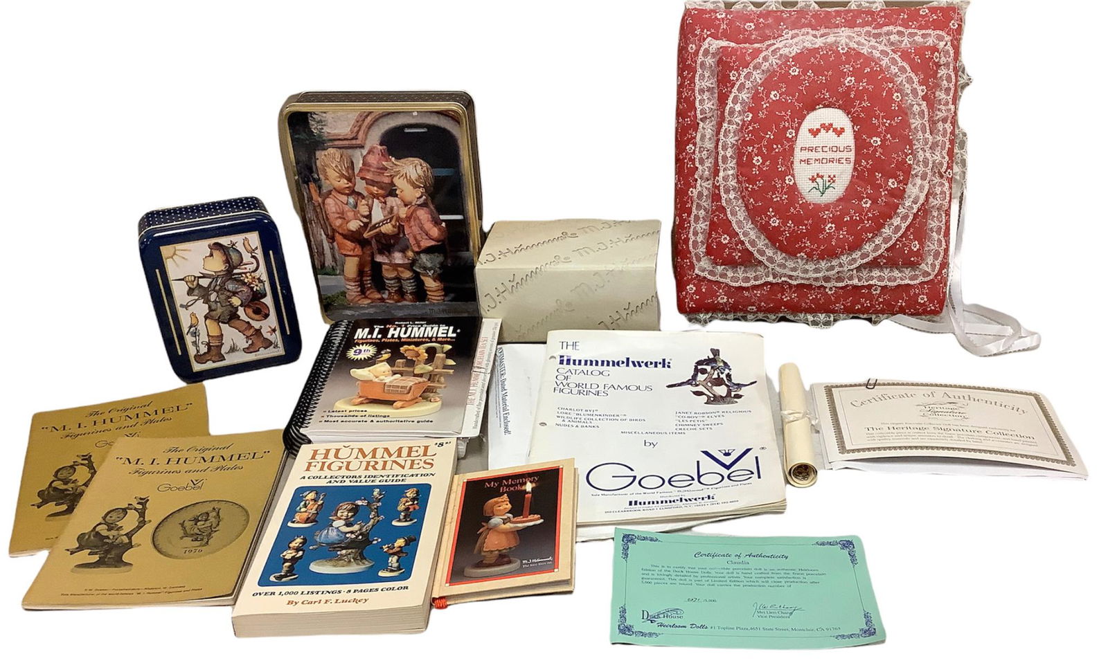 Lot of 5 Hummel figurine guides and a Hummel memory book, 2 Hummel tins; one with stationary, an (1 of 1)