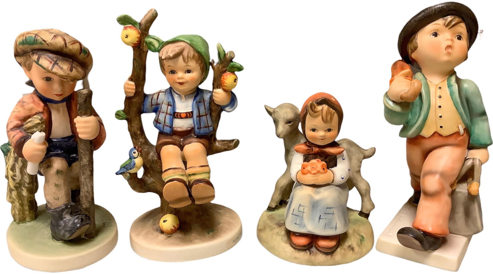 Lot of 4 Hummels including Apple tree boy, merry wanderer, on the secret path & good friends. (1 of 2)