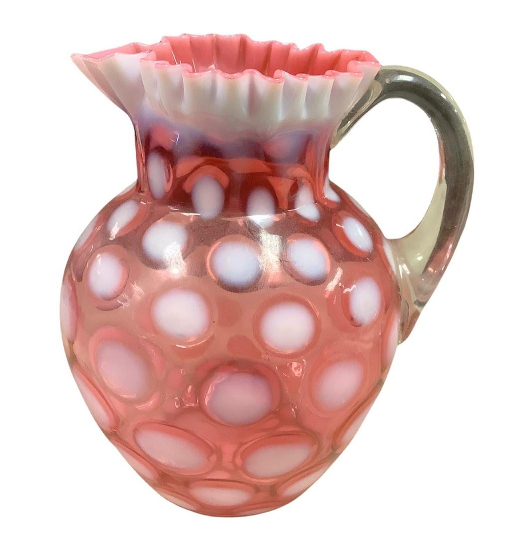 Vintage large cranberry glass pitcher @ approx 9" tall, 9" wide. Pitcher has a white coinspot (1 of 1)