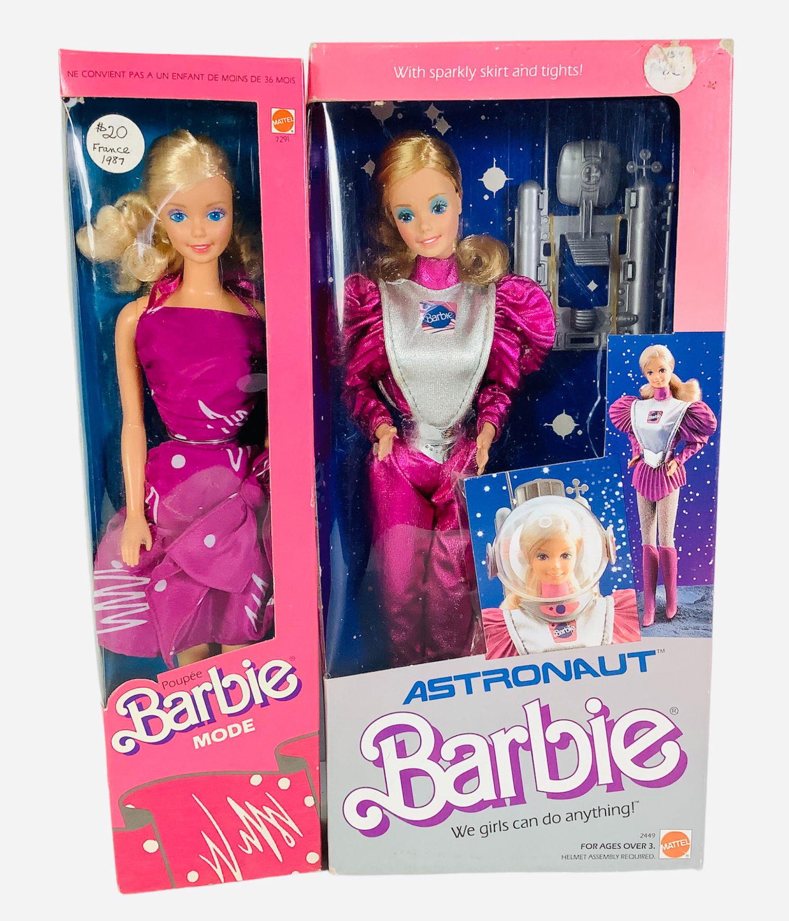 (2) pink boxed Barbies. Astronaut Barbie in hot pink and silver spacesuit. Her box has slight: (2) pink boxed Barbies. Astronaut Barbie in hot pink and silver spacesuit. Her box has slight scuffing on 3 sides. Barbie Mode, a 1987 France Barbie with a pretty purple and polka dot dress & her box