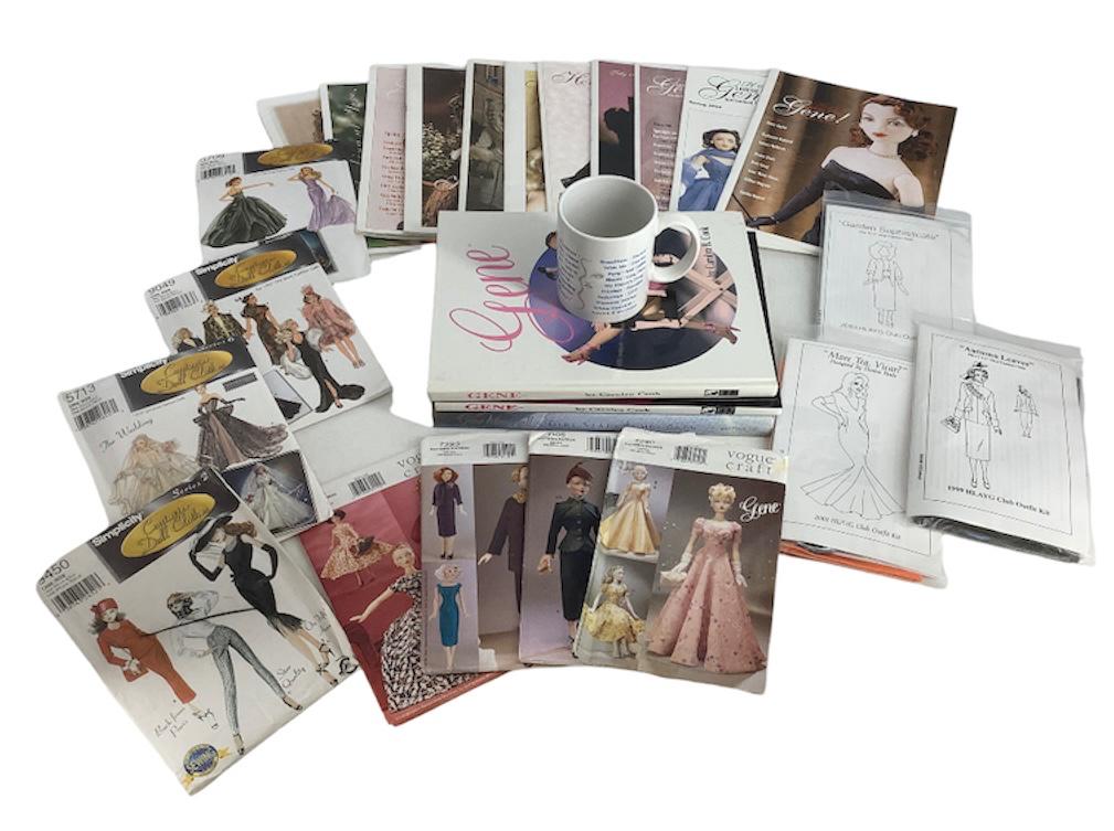 Lot including Gene Doll books, clothe patterns, news letters and a coffee cup. (1 of 3)